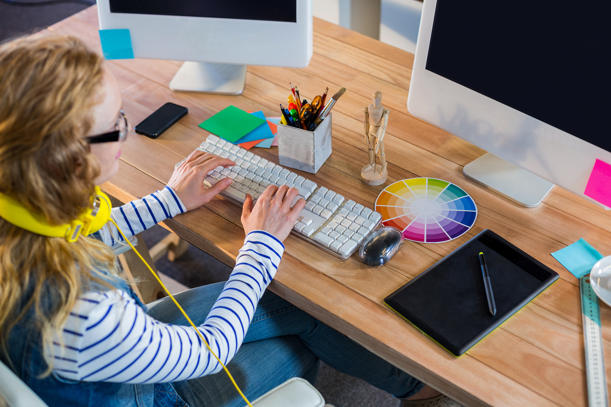 designer typing on keyboard in the office