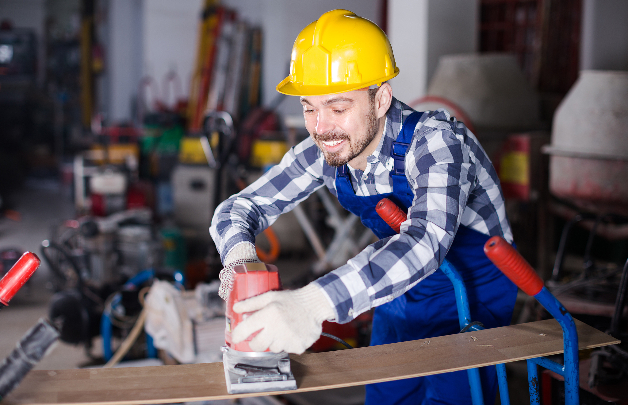 male 29-36 years old is using grinder for construction work