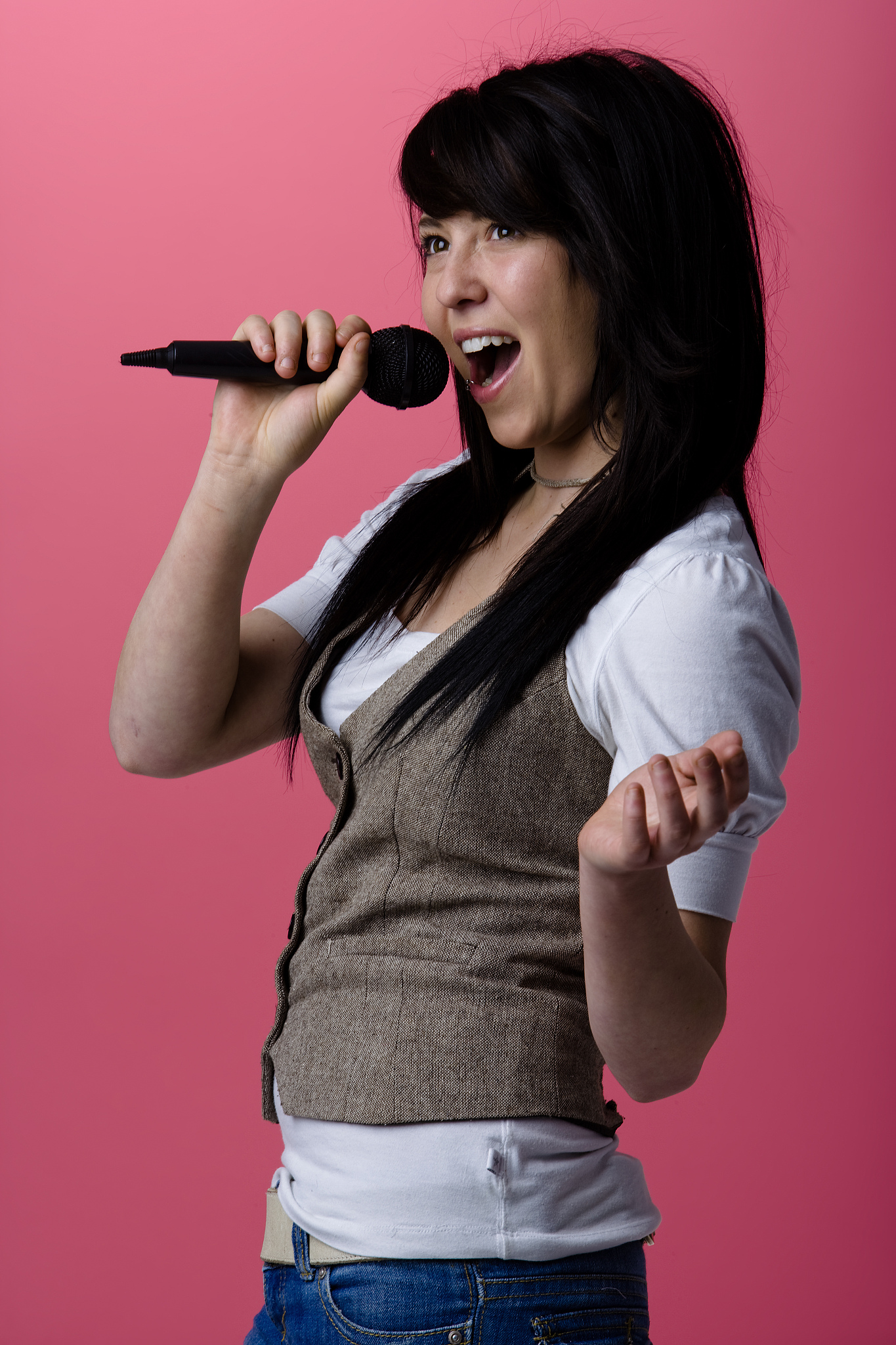 woman singing into microphone