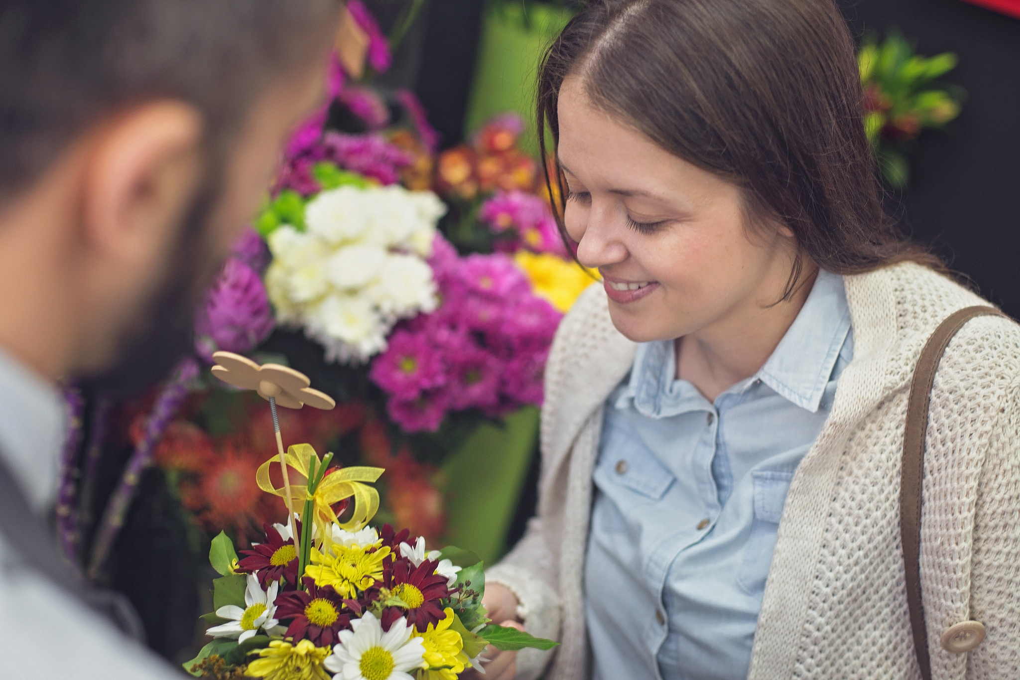 beautiful woman buying flower bouquet