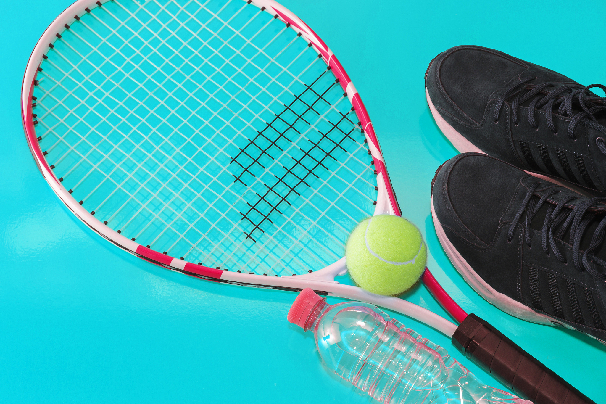 tennis racket with a ball and sneakers, on a bright background. 