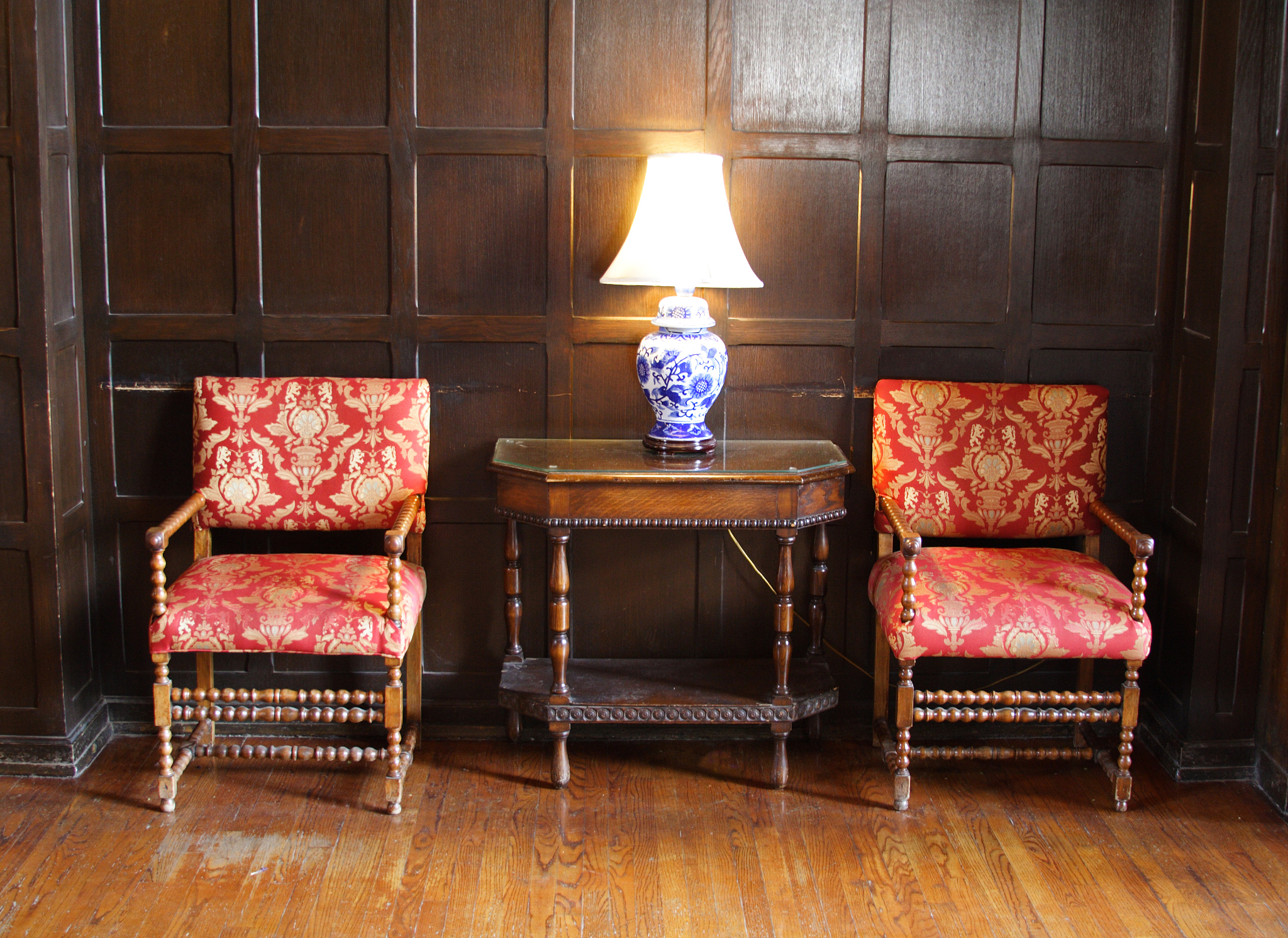 old chairs and table with lamp