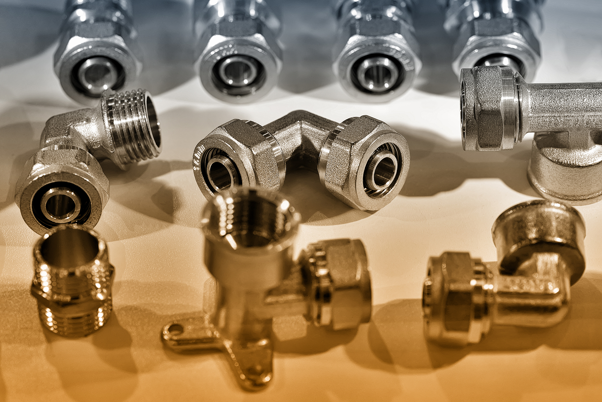 a variety of plumbing pipe connectors, corners, fittings. brown 