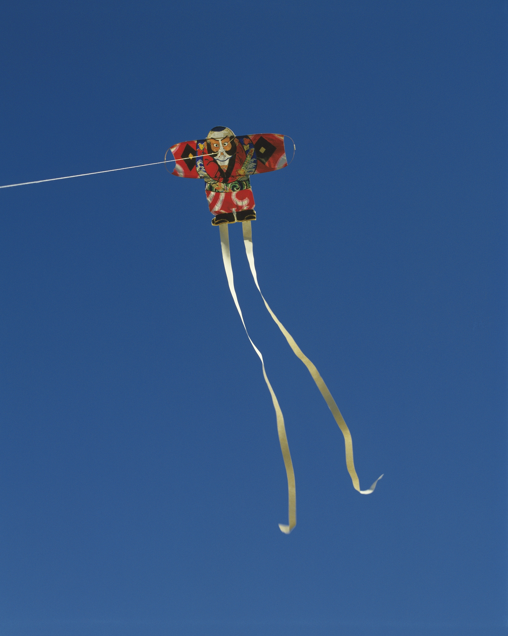 kite in the sky, blue background