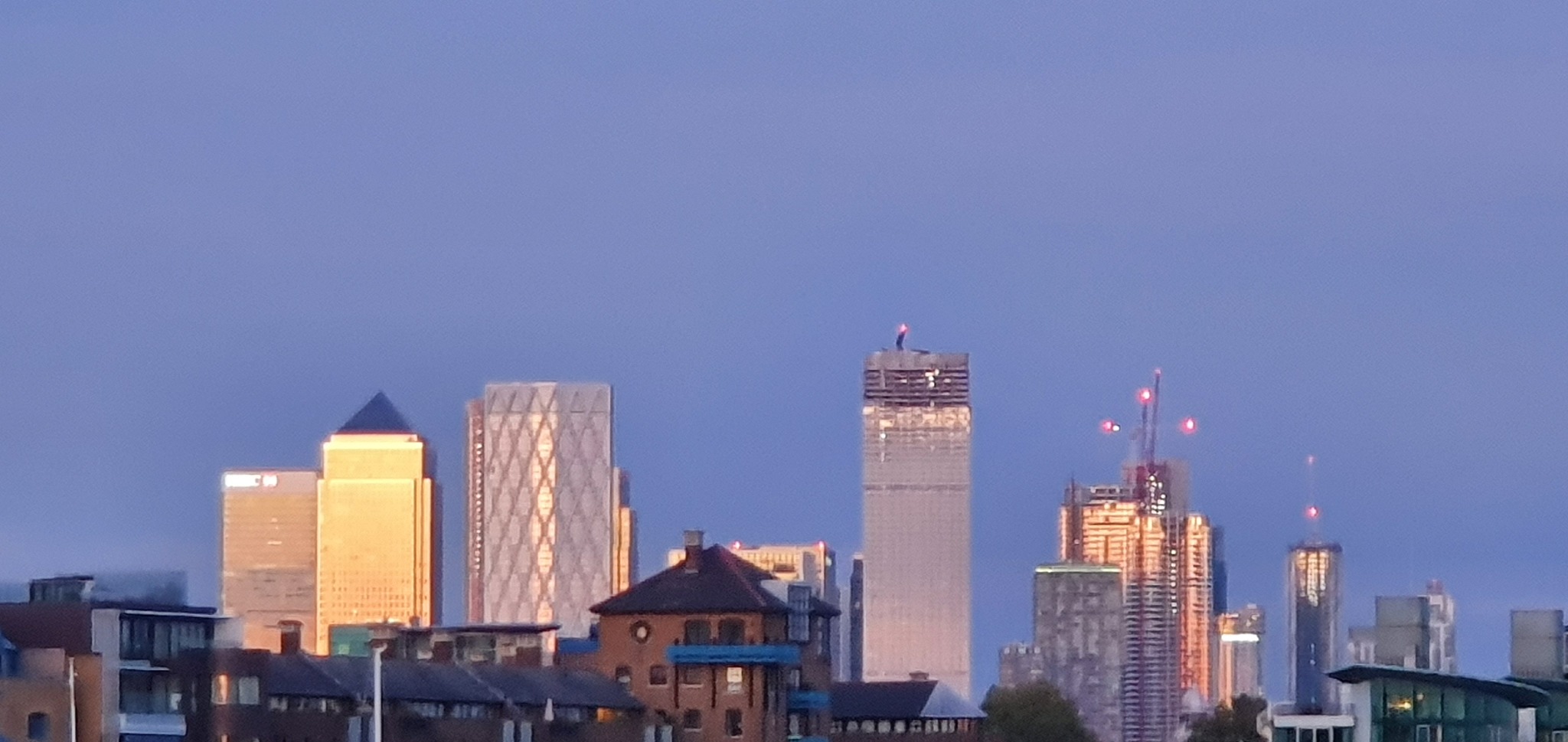 buildings in city against clear sky