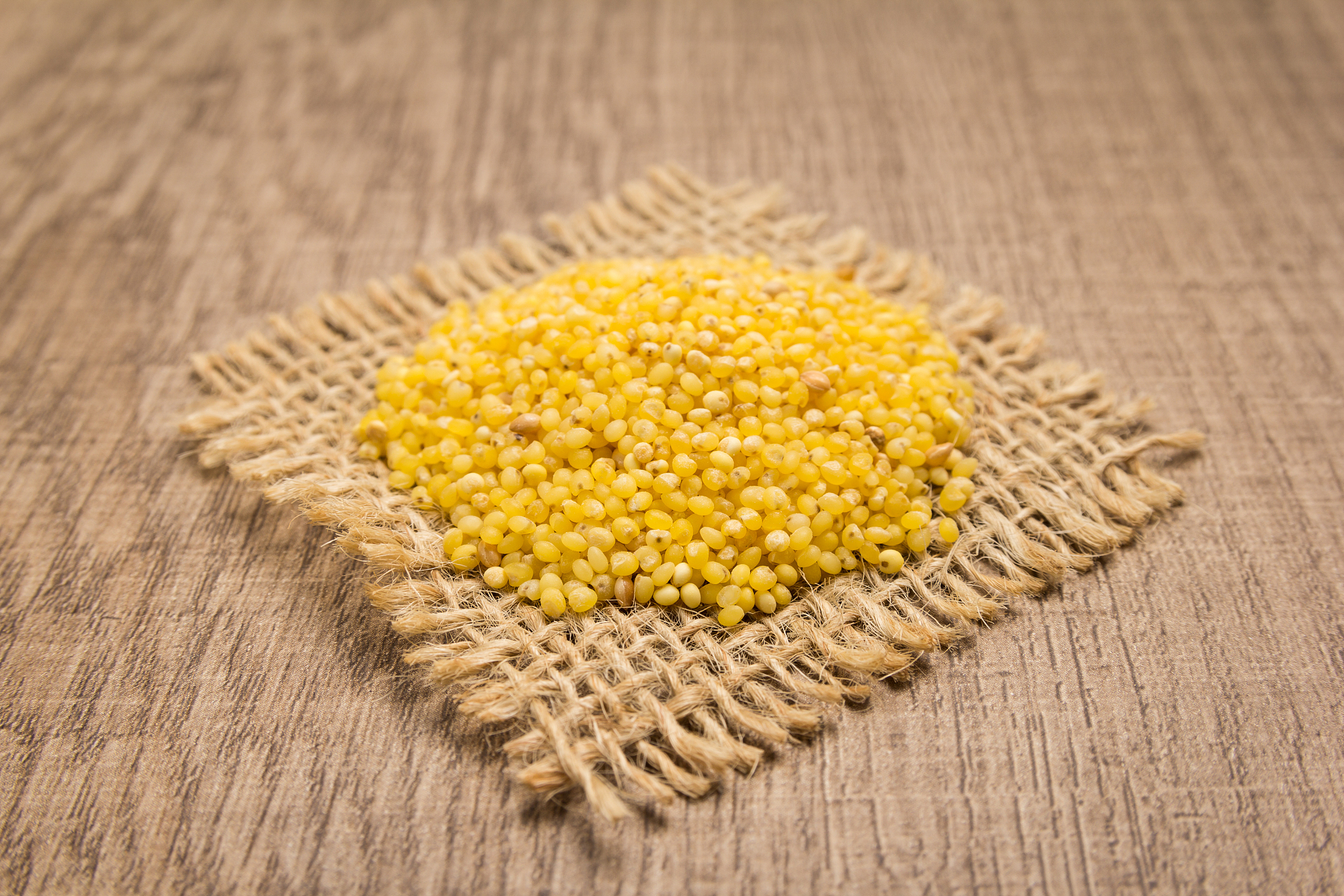 close-up of legumes on burlap over table