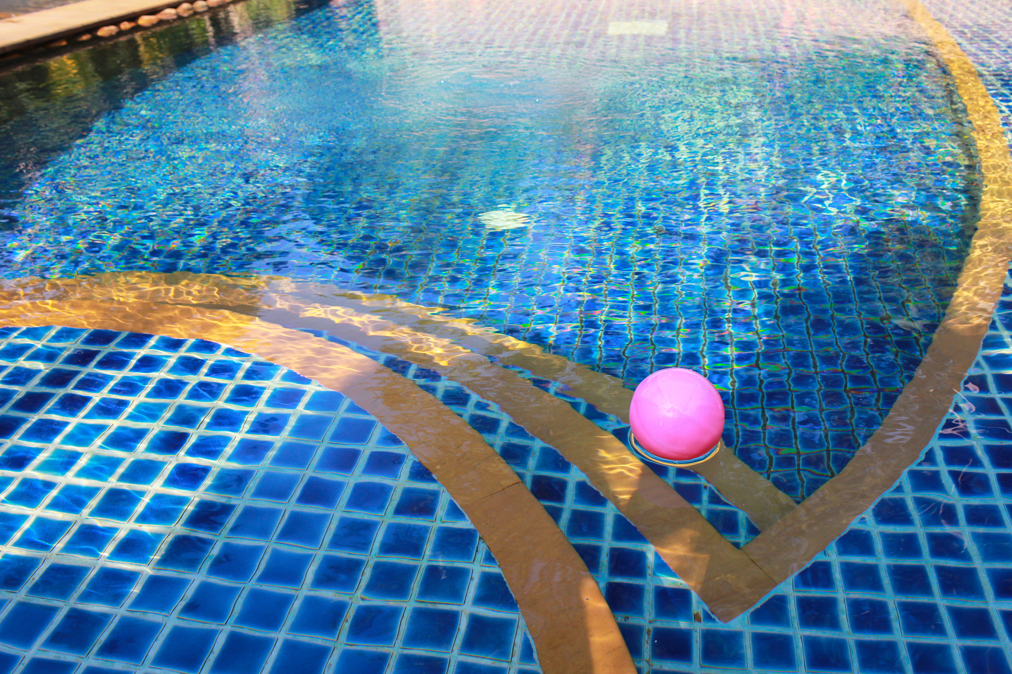 small pink ball and swimming pool.