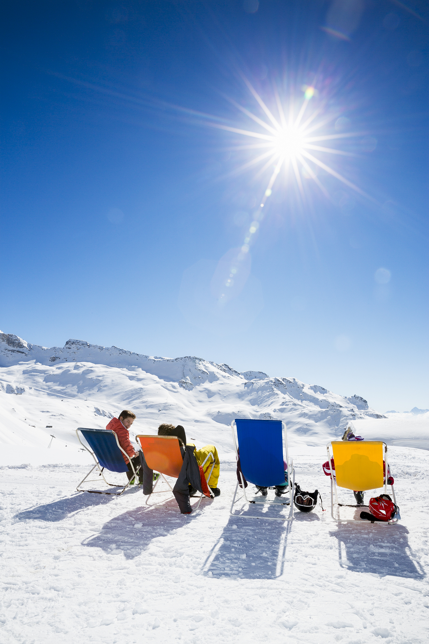 friends sunbathing in mountains