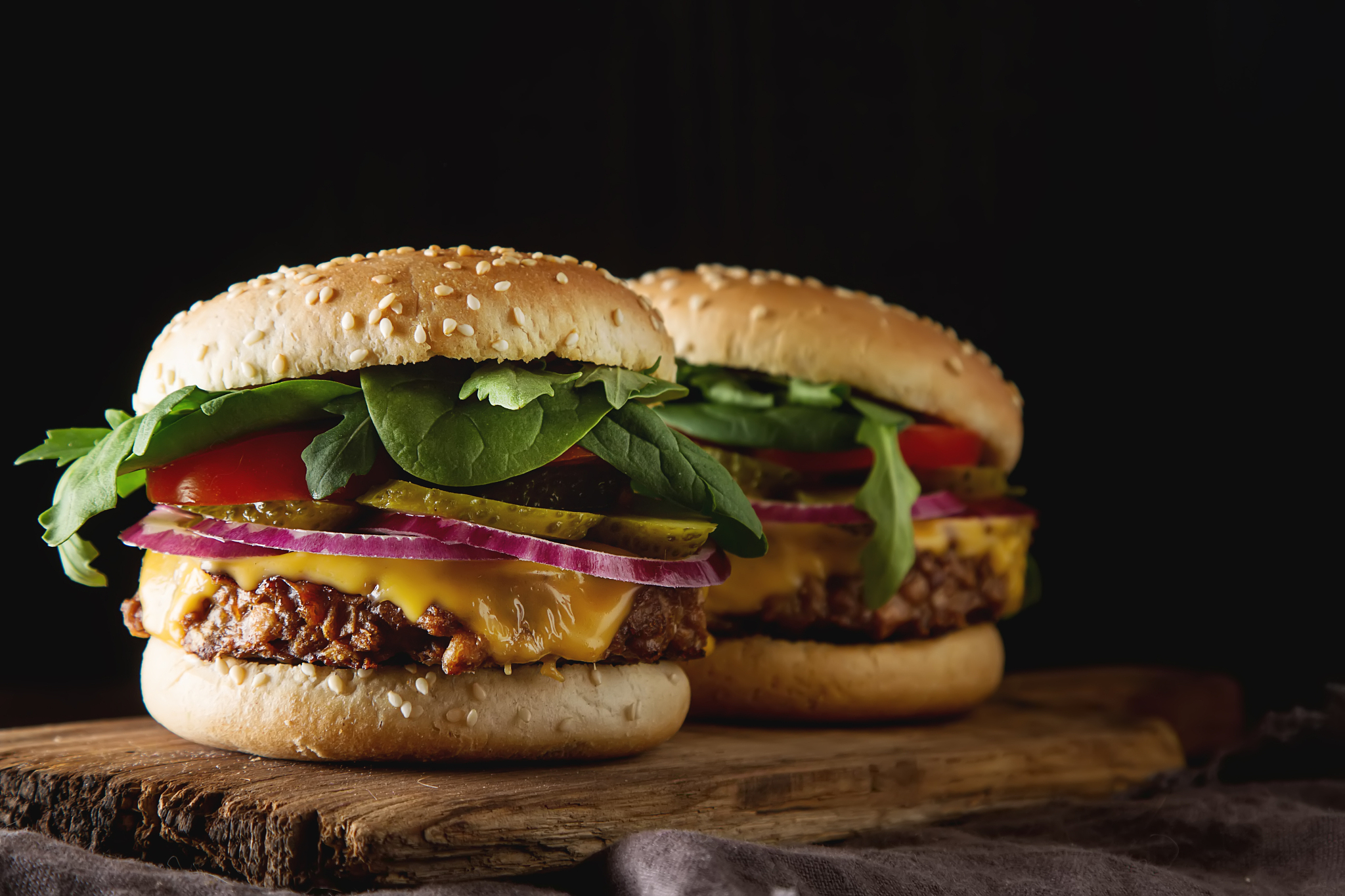 fast food. vegetarian burger with a chop, cucumber, tomato and l