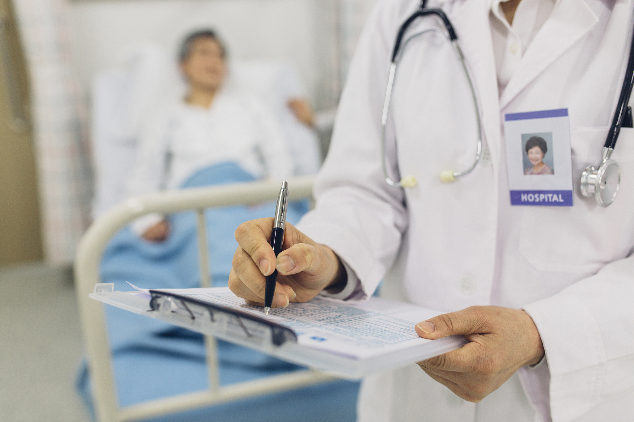 doctor holding medical record