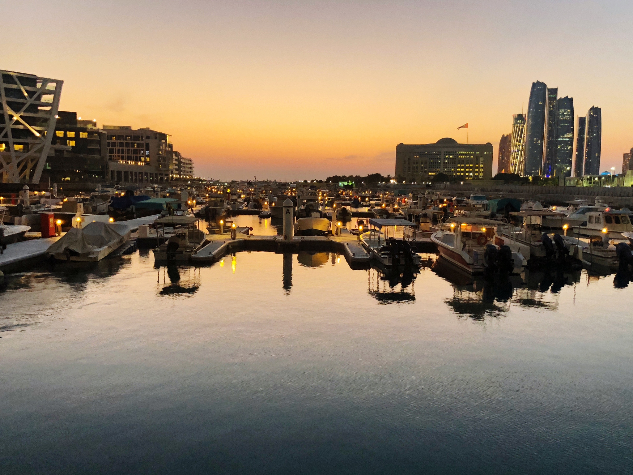 river in city against sky during sunset