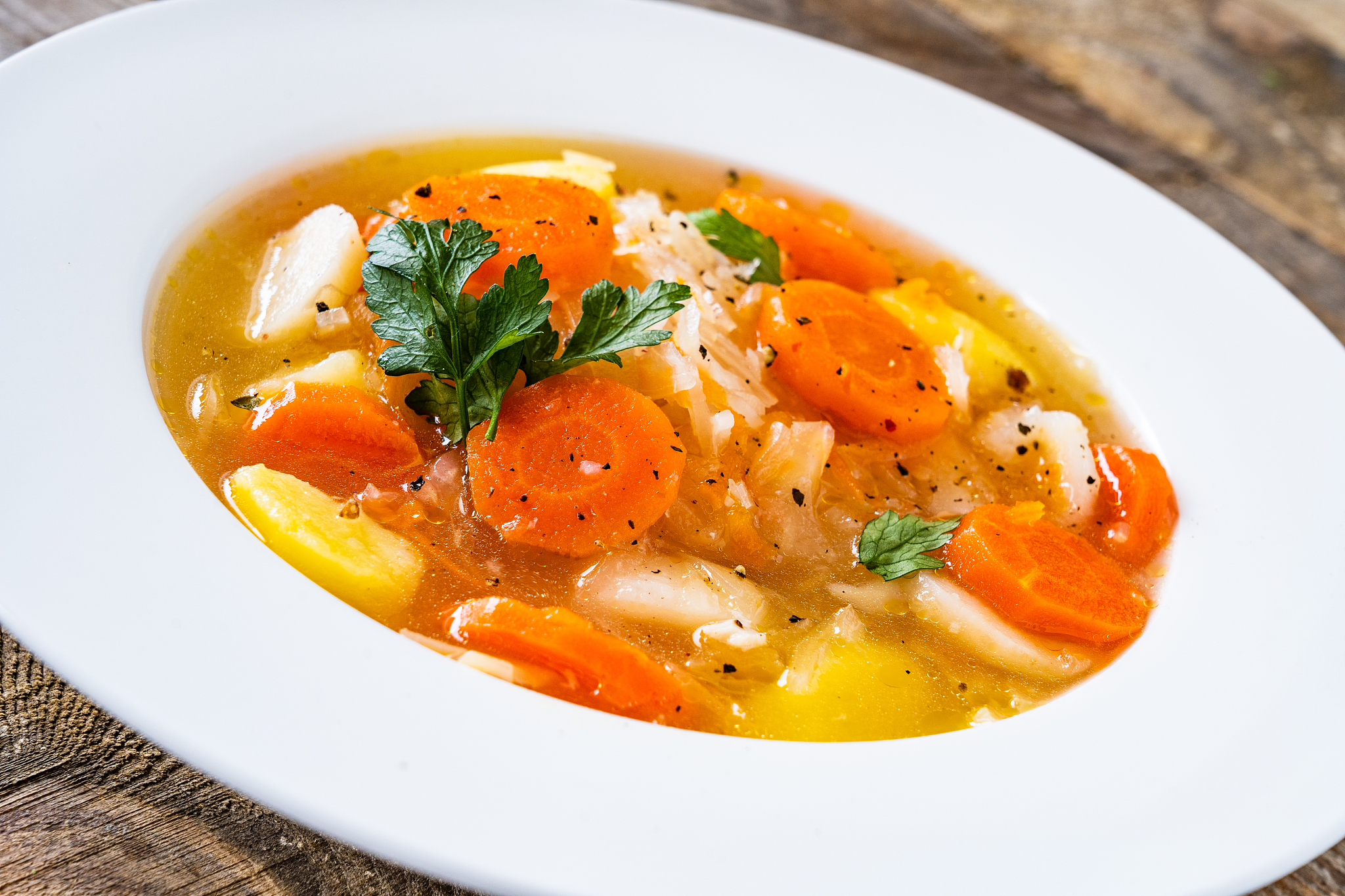 cabbage soup served on wooden table