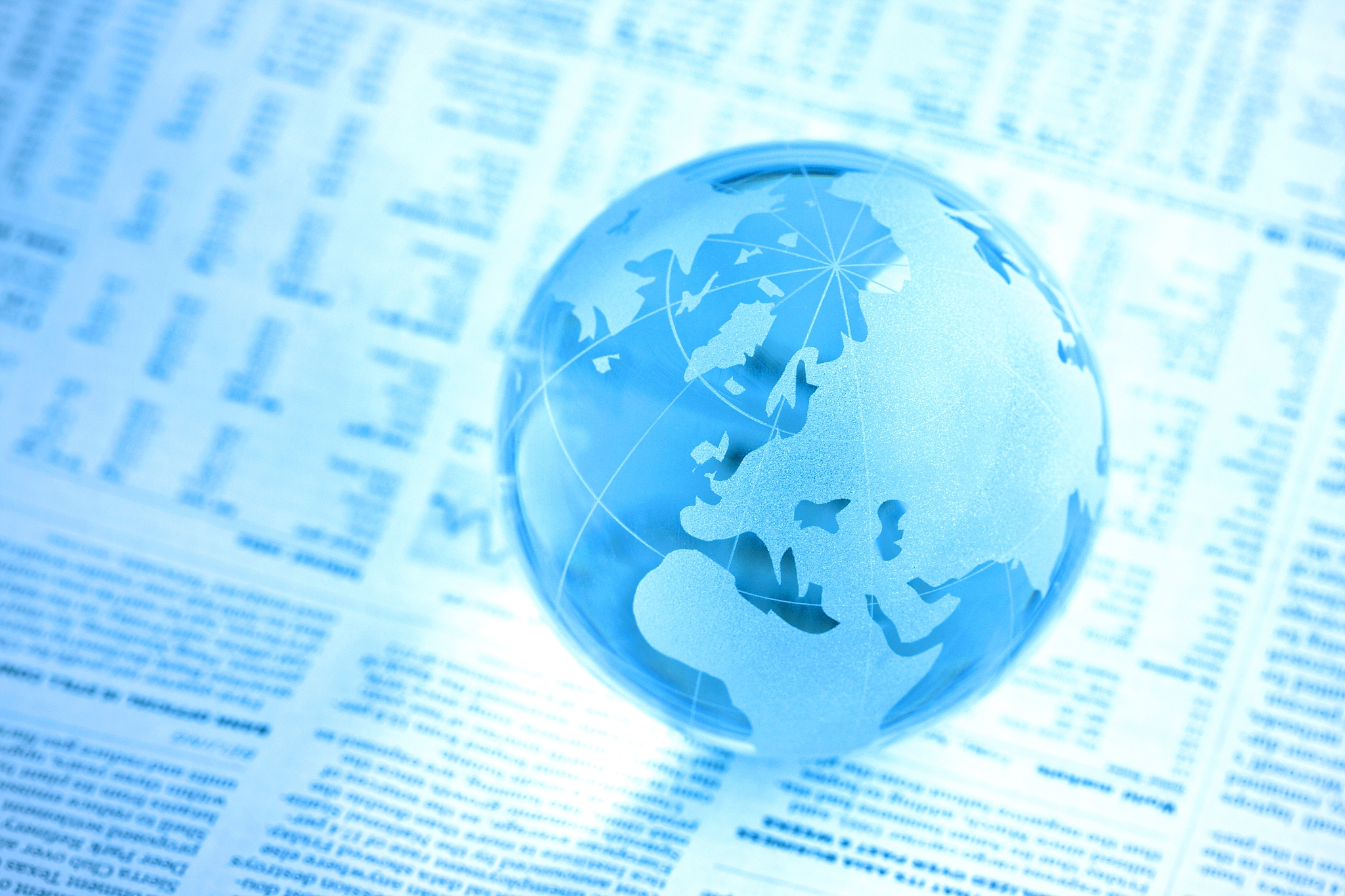 glass globe on newspaper