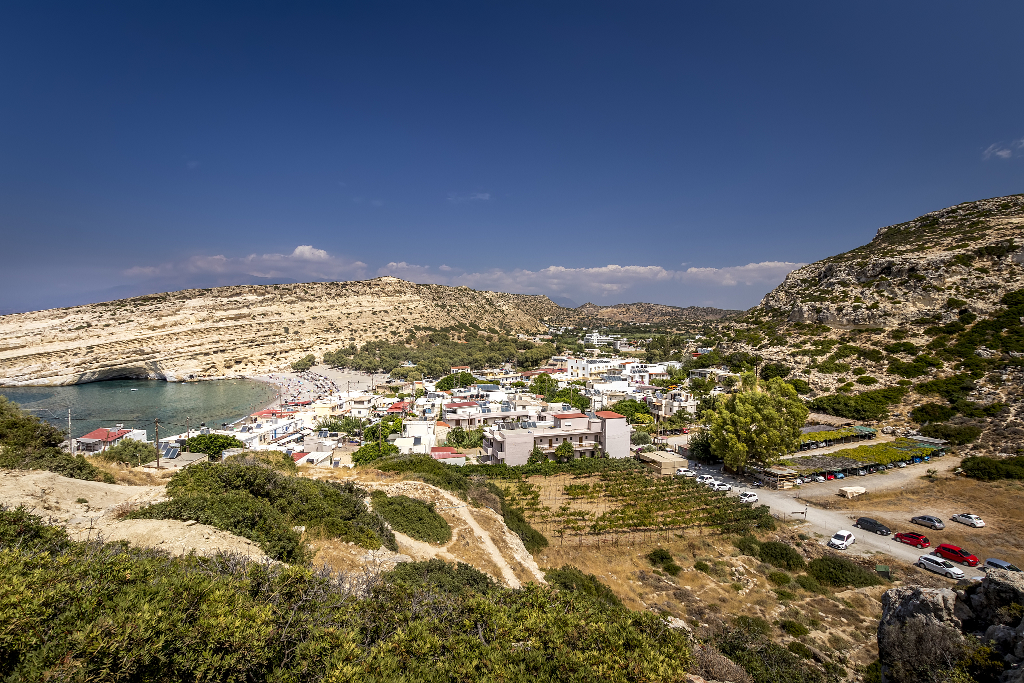 the coast and mountains of matala on a clear summer sunny day. c