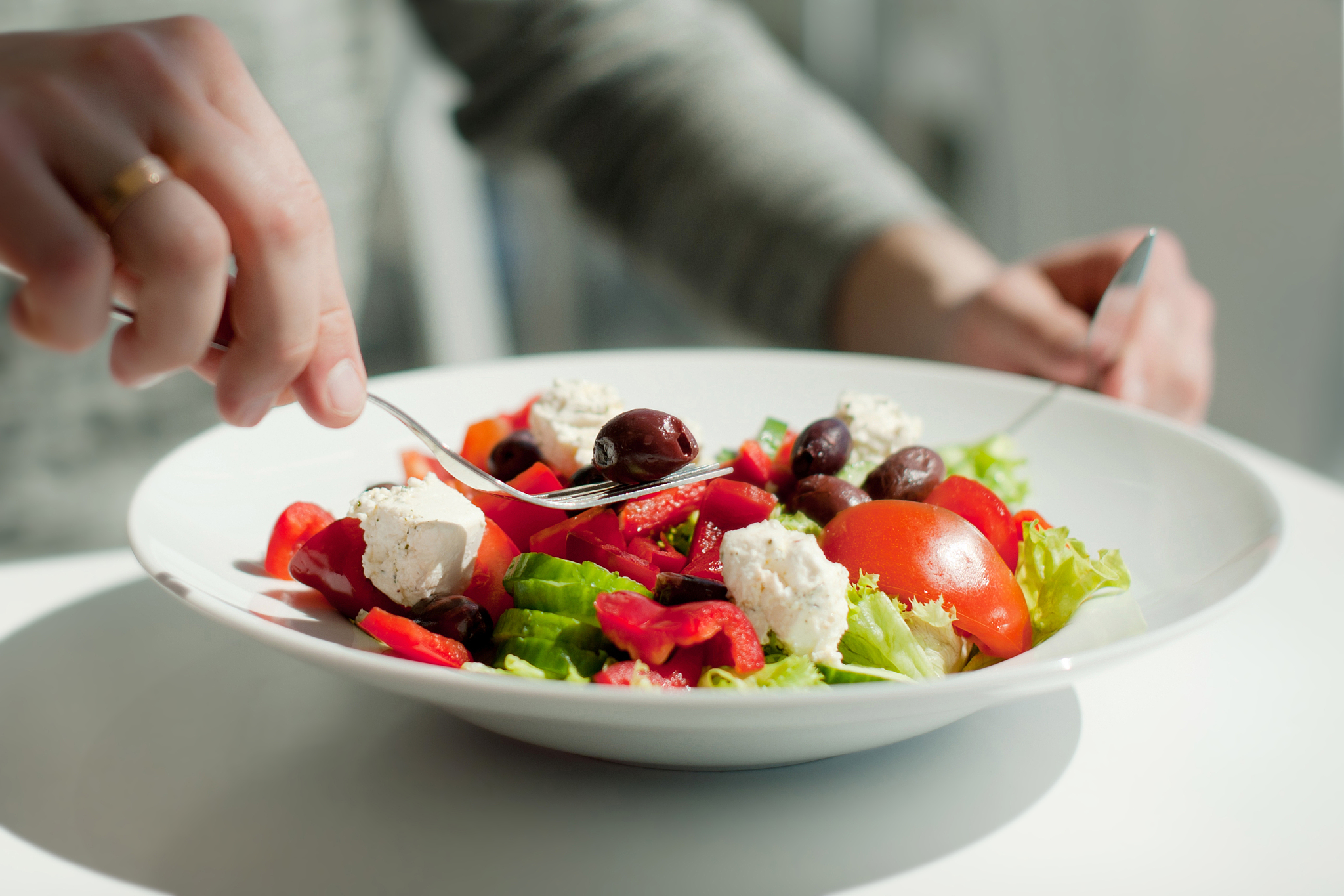 close-up of person having food at table