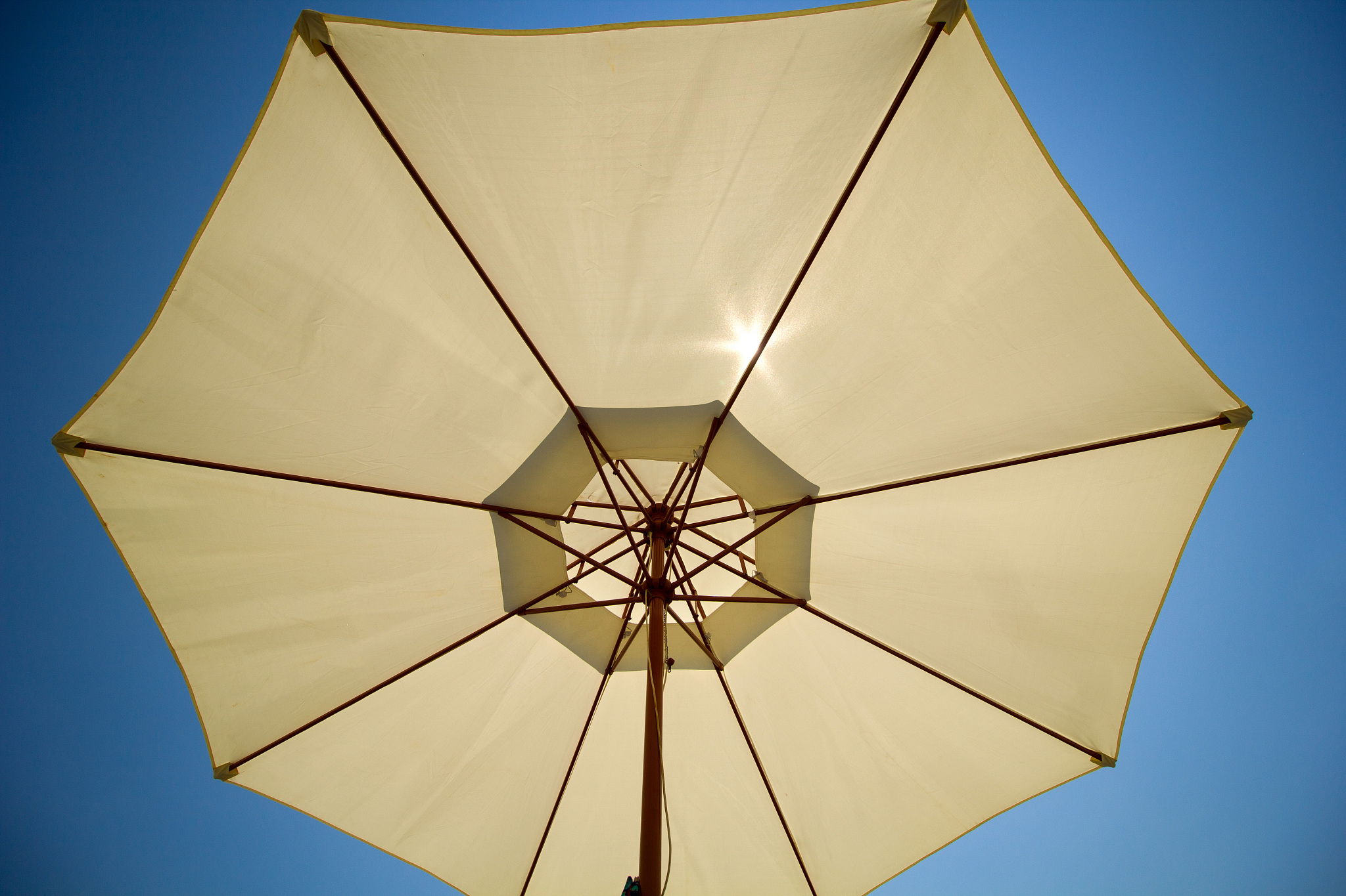beach umbrella against the blue sky
