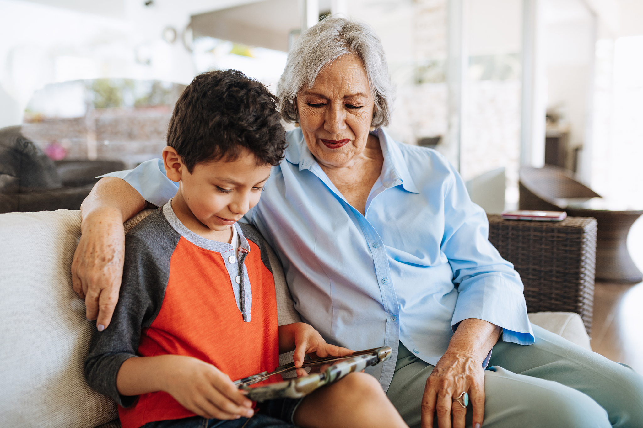 latina grandmother and her grandson enjoying time together.