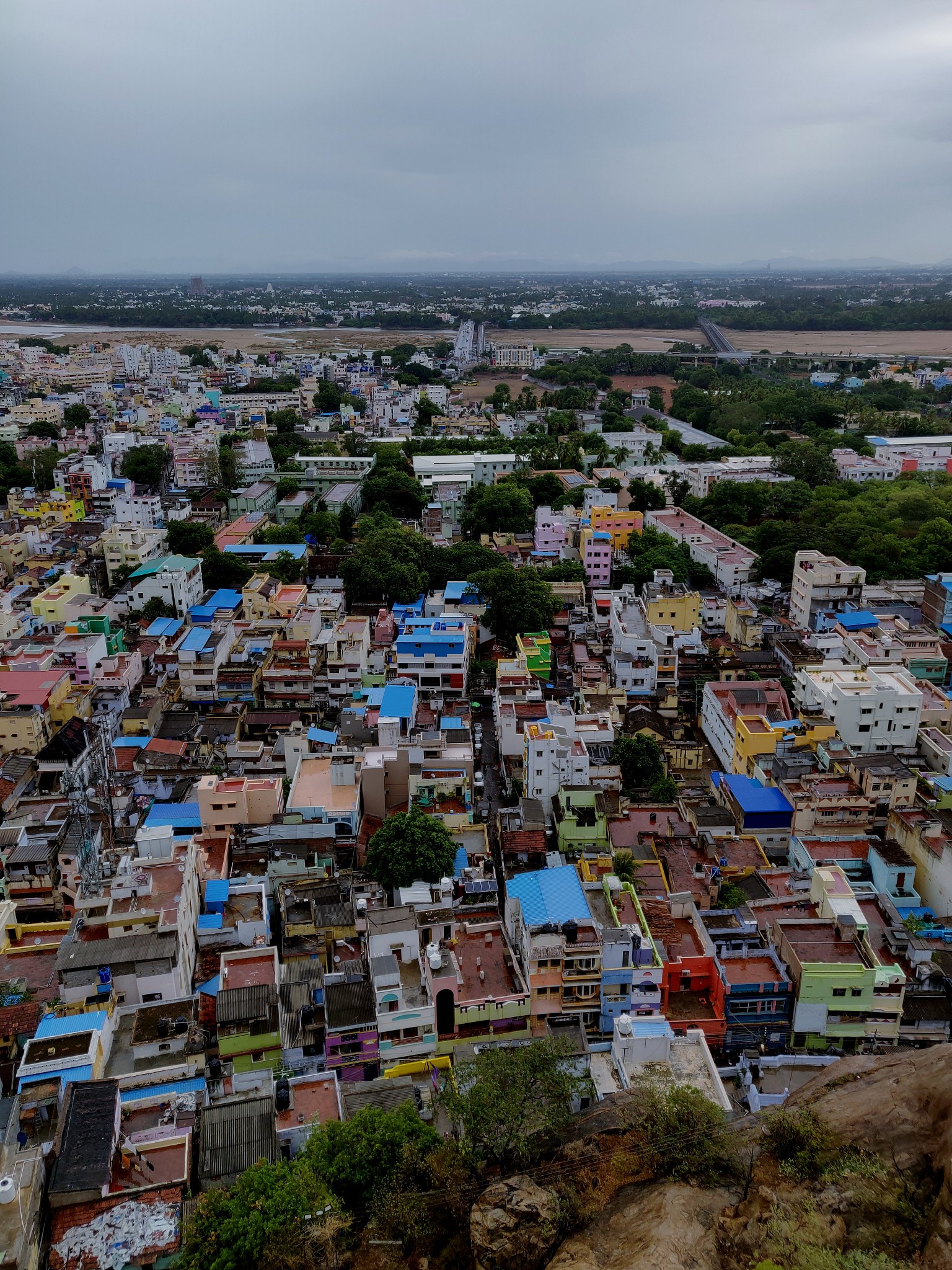 high angle view of townscape by sea against sky