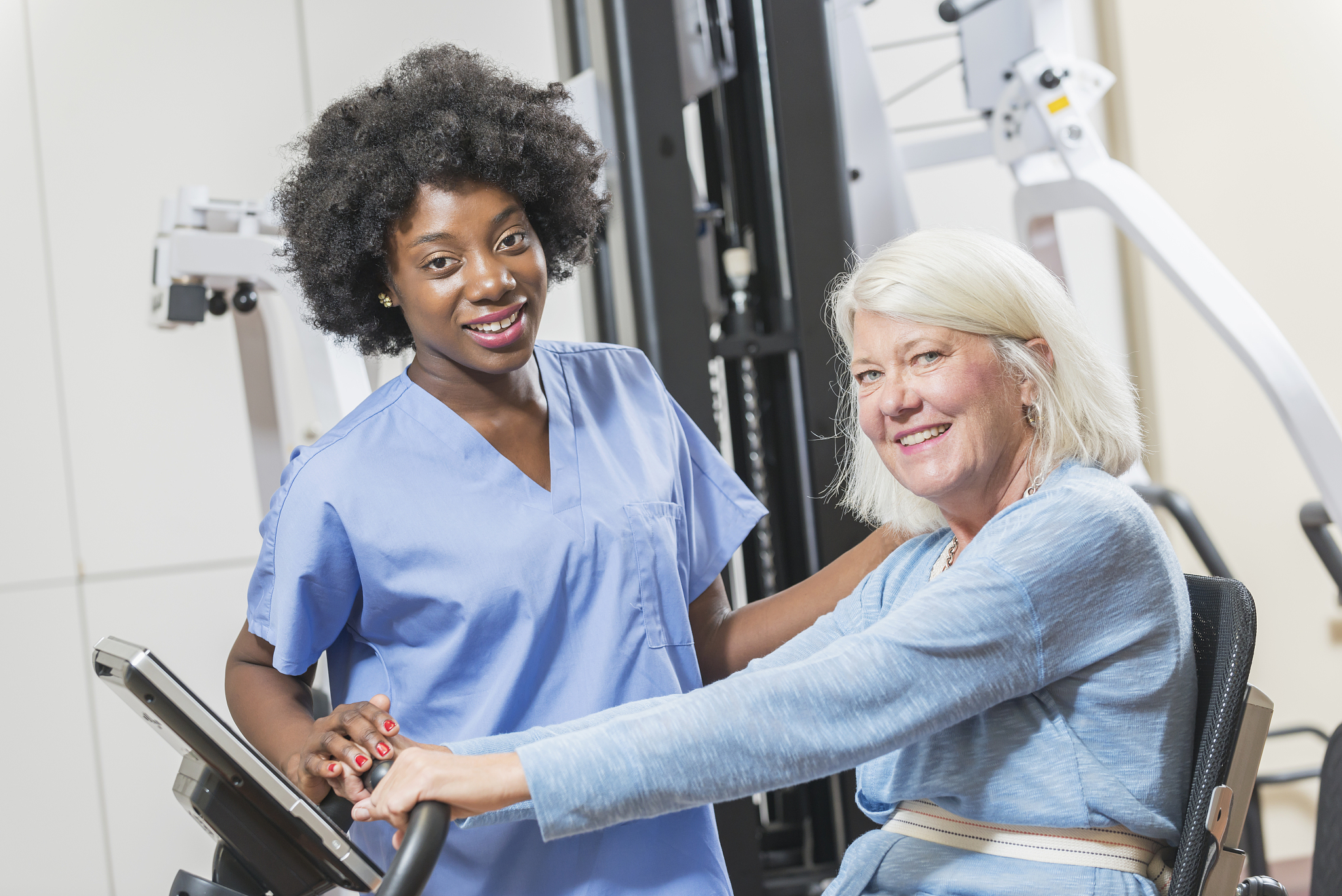 african american physical therapist working with patient
