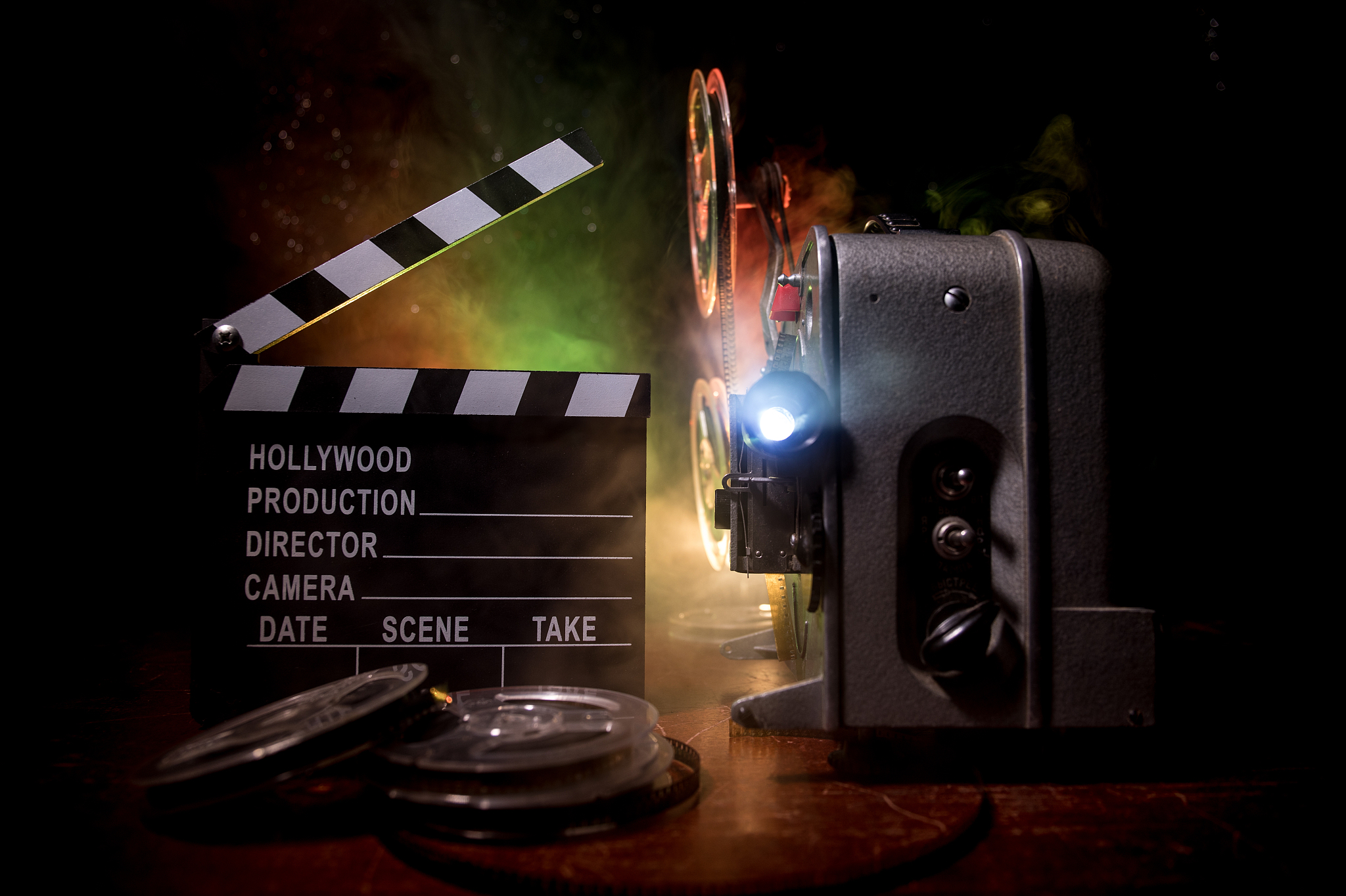 old vintage movie projector on a dark background with fog and li