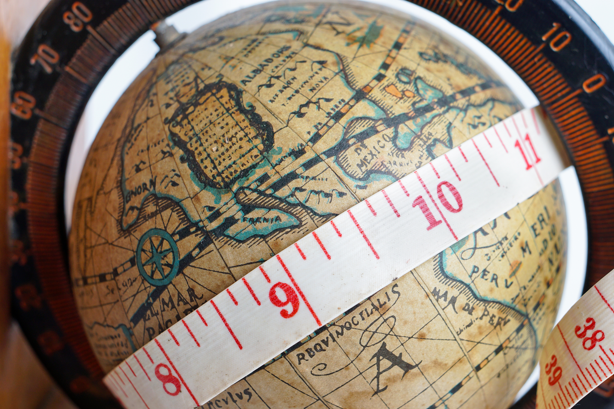vintage global map with measuring tape