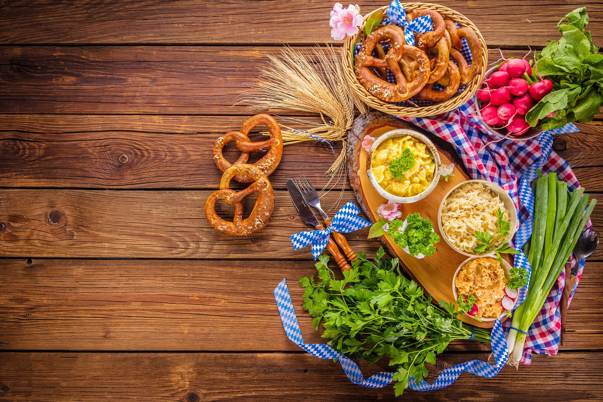 oktoberfest beer, pretzels and various bavarian specialties on w