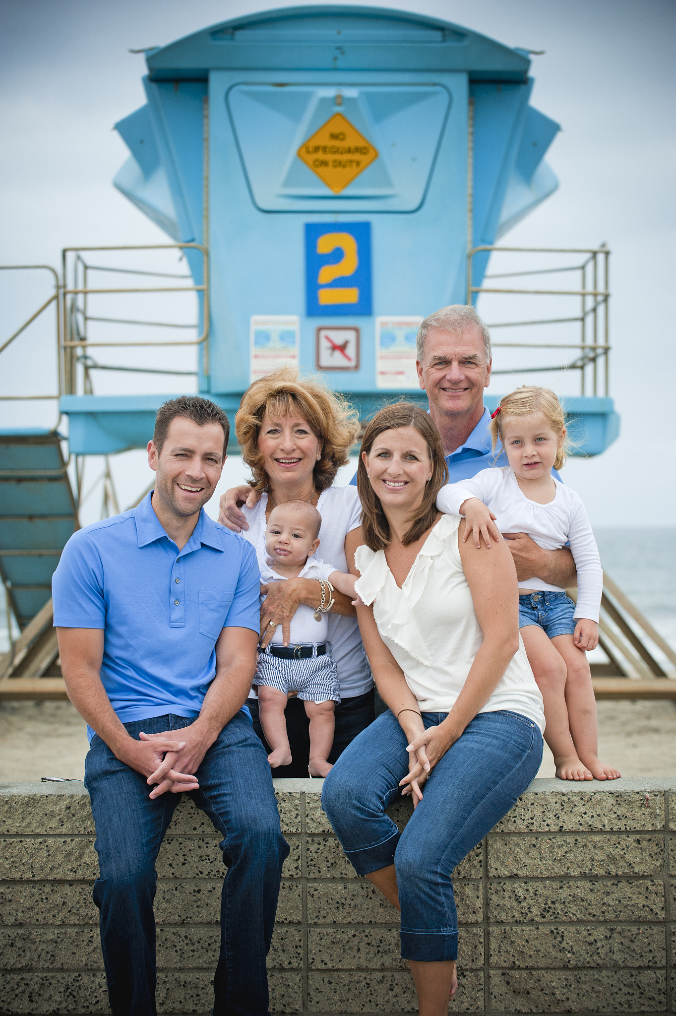 three generations portrait with lifeguard tower