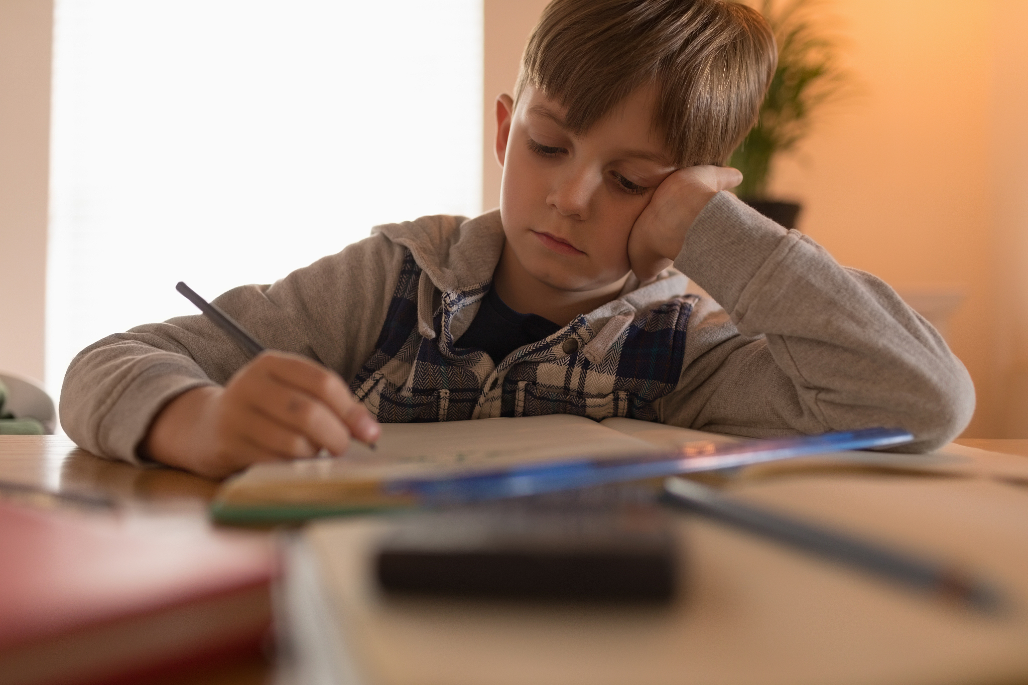 boy doing his homework at home