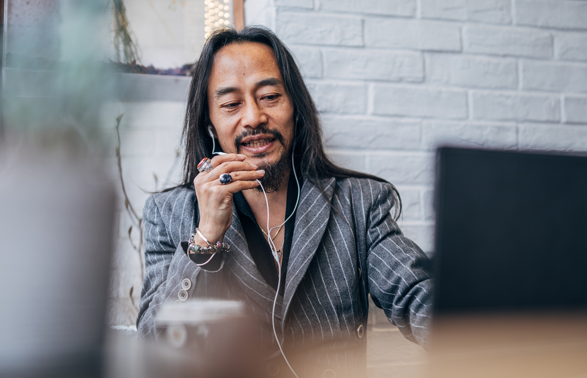 chinese gentleman using laptop for online chat