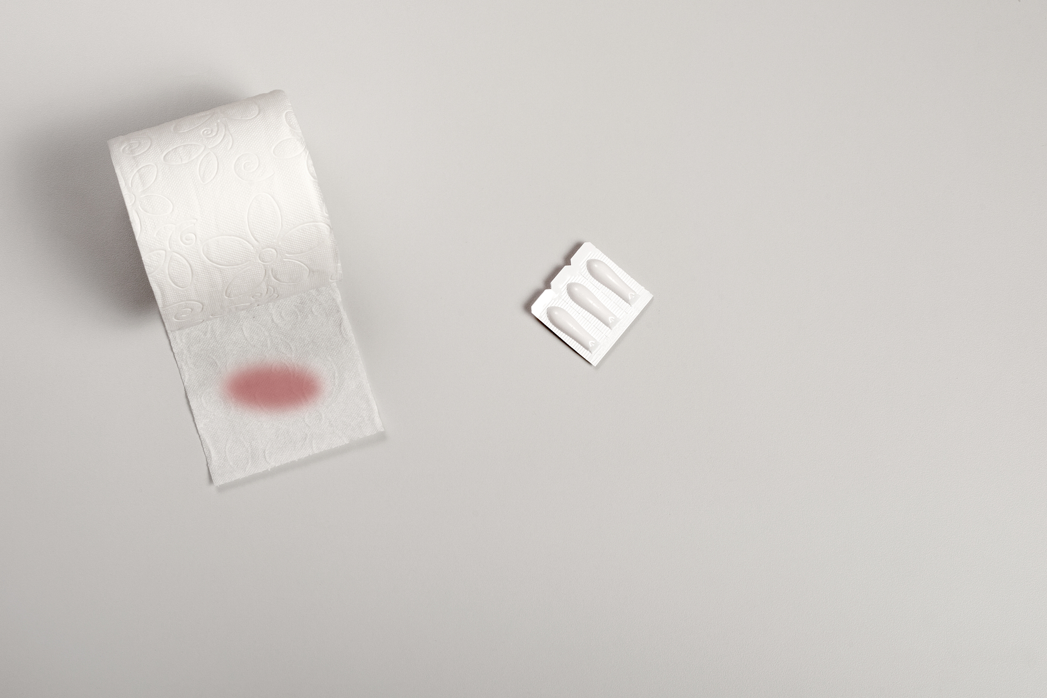 hemorrhoid medicine suppository over table