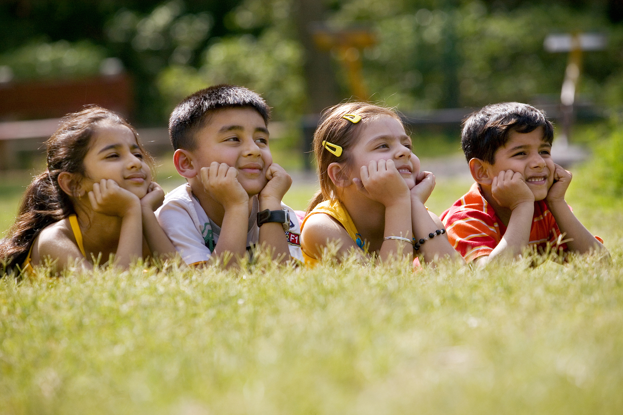 children with hands under their chin