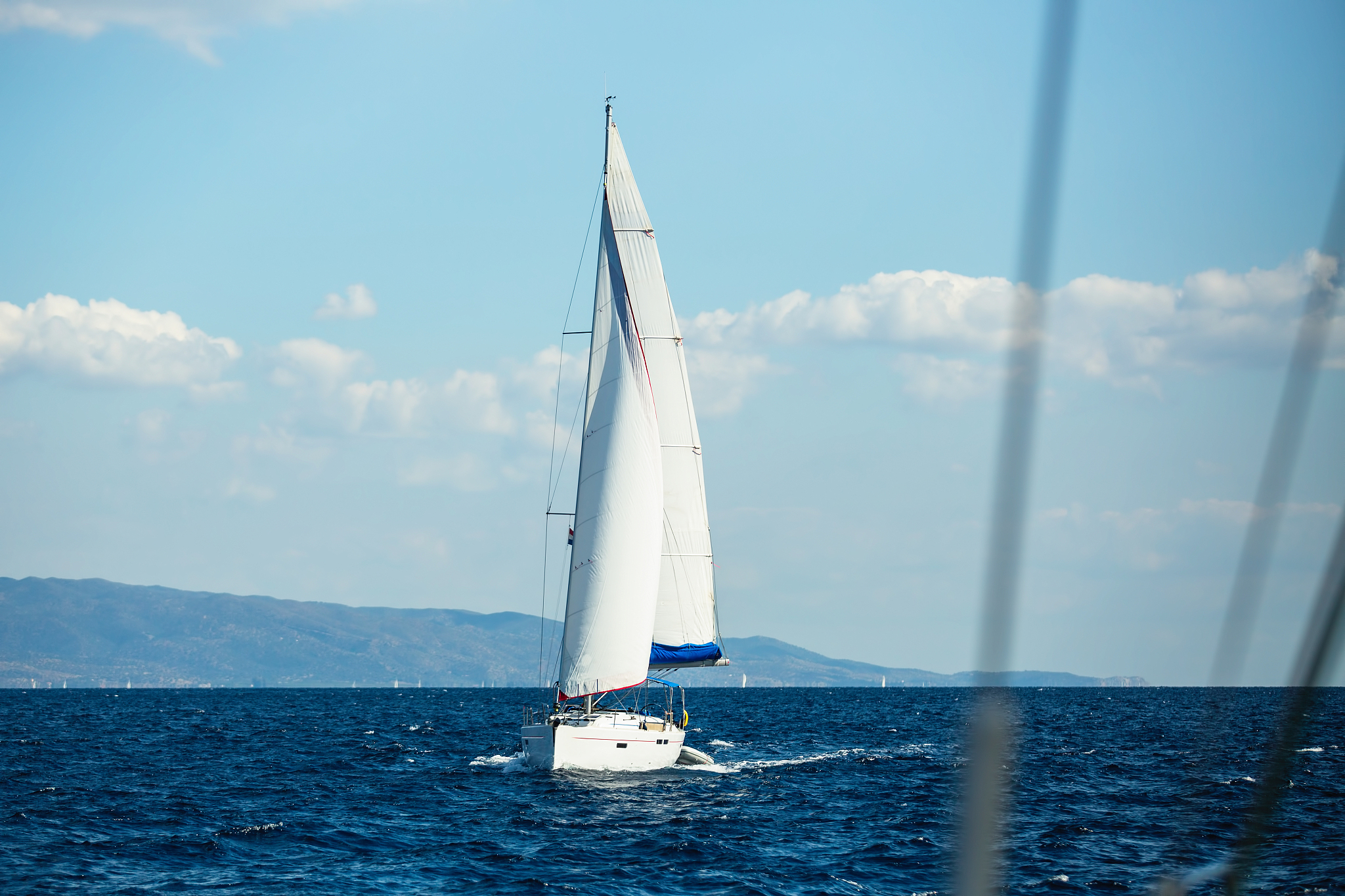 sailing ships yacht glides through the waves.
