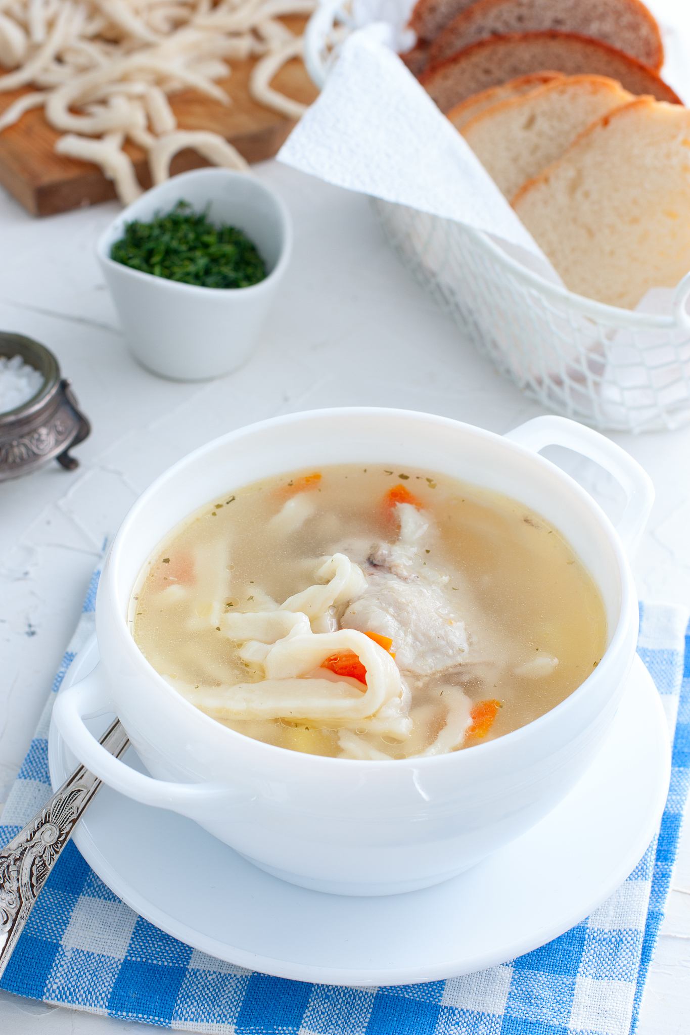 hot homemade soup on chicken broth with homemade noodles in a wh