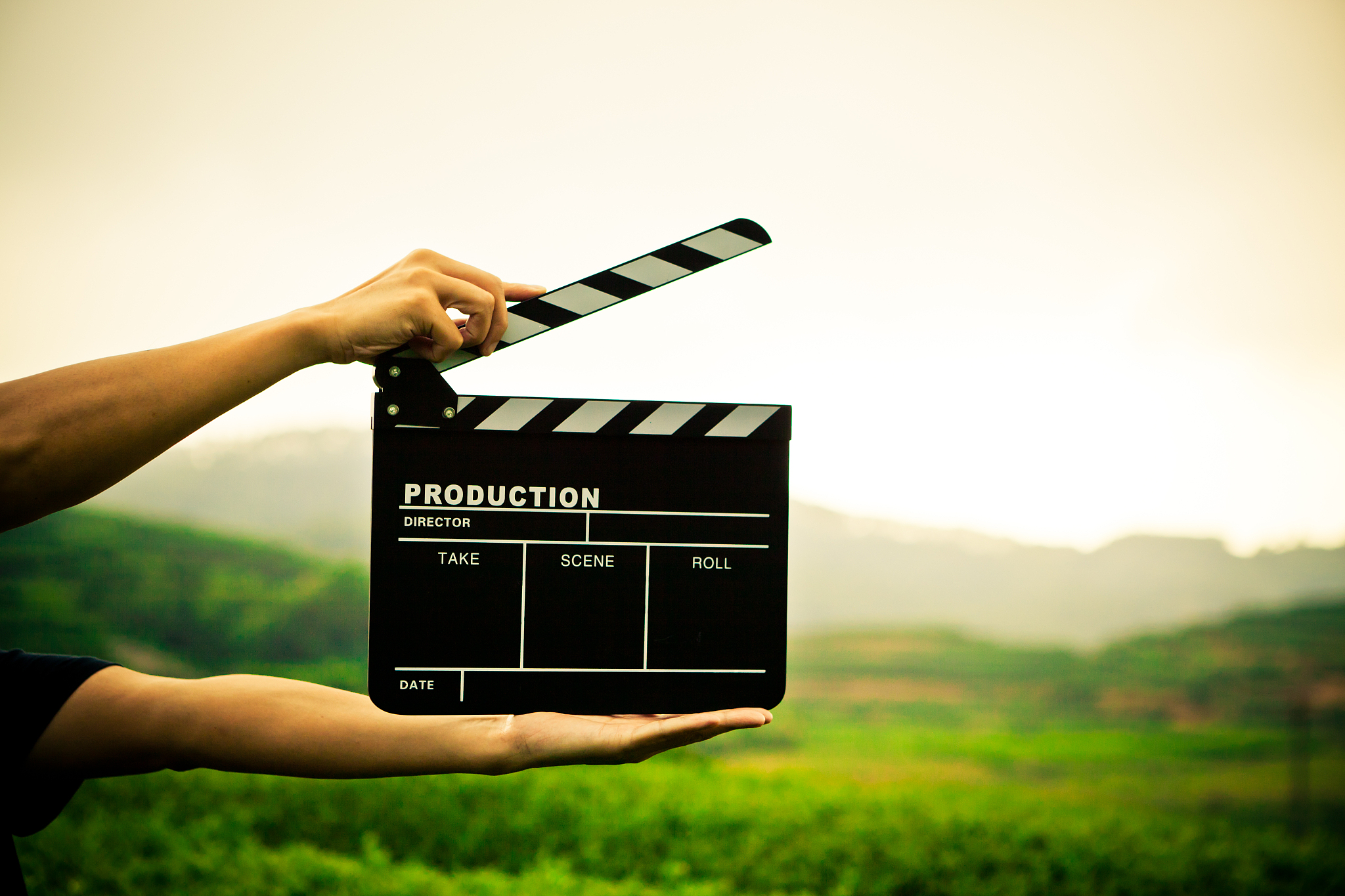 clapper board with hand