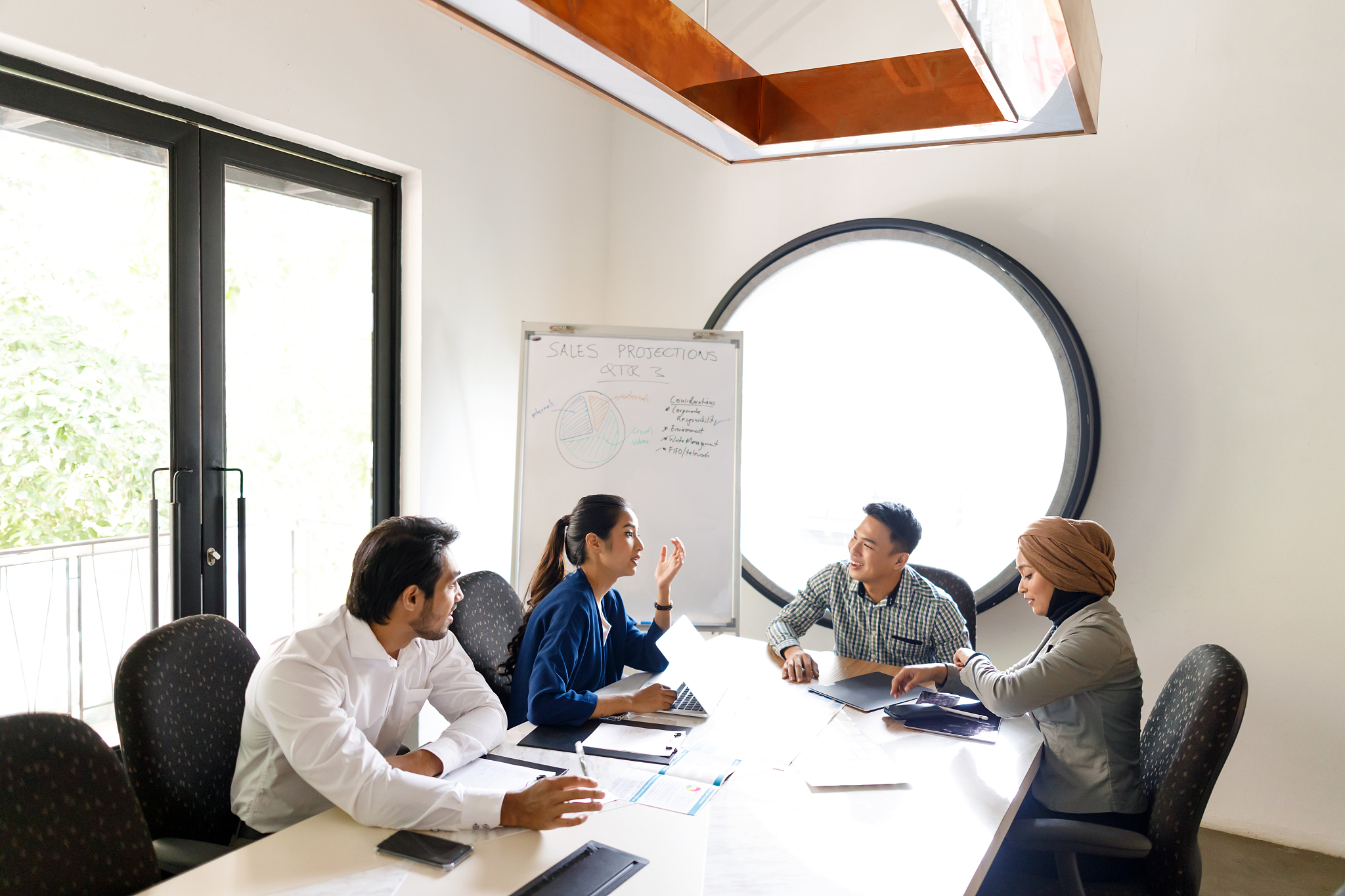 diverse sales team discussing ideas