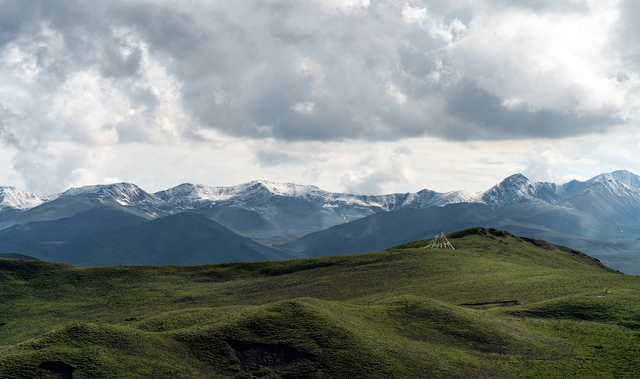 view of mountains under overcast sky