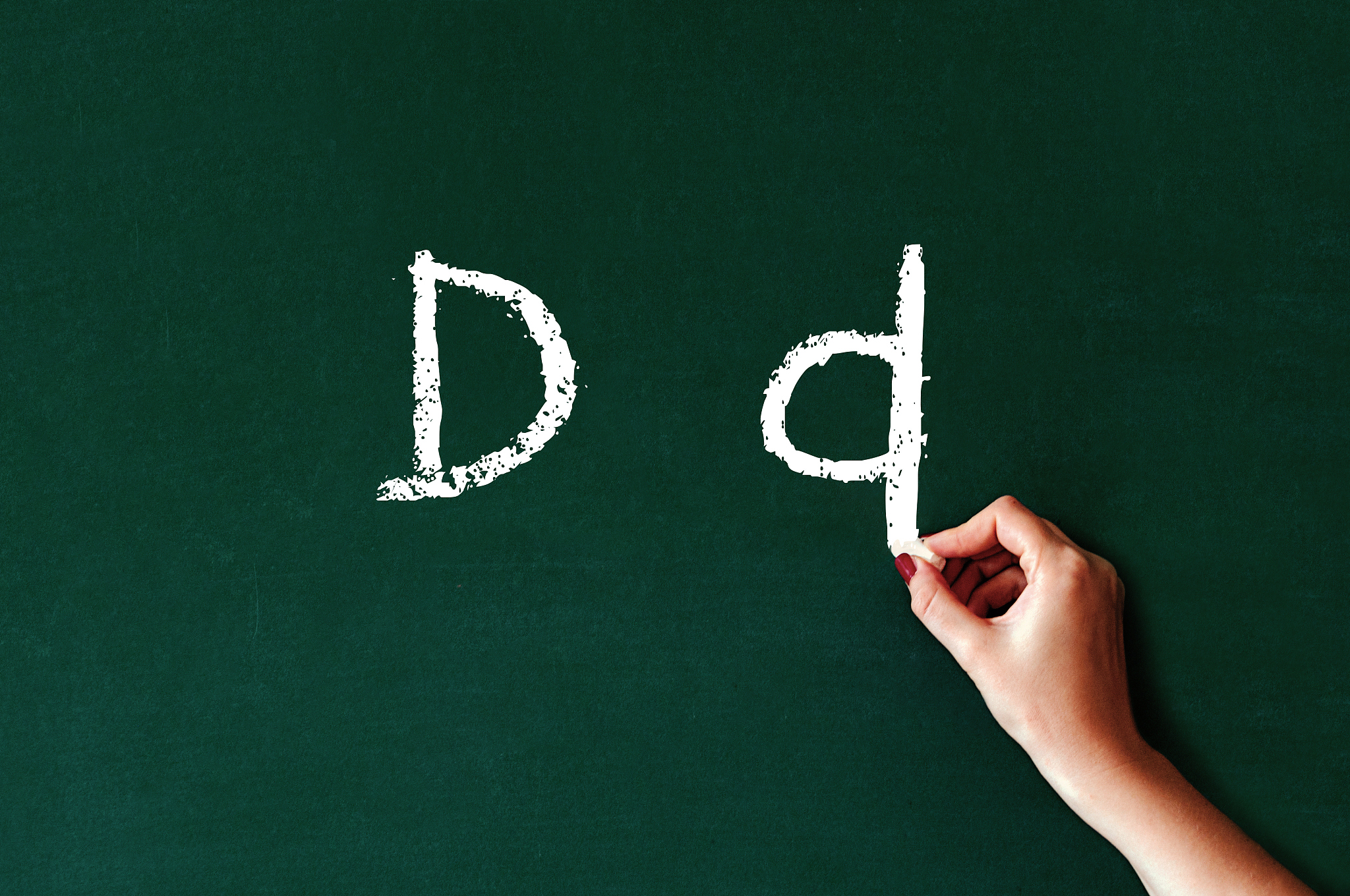 unre<strong>c</strong>ognizable person writes the capital and lowercase letters