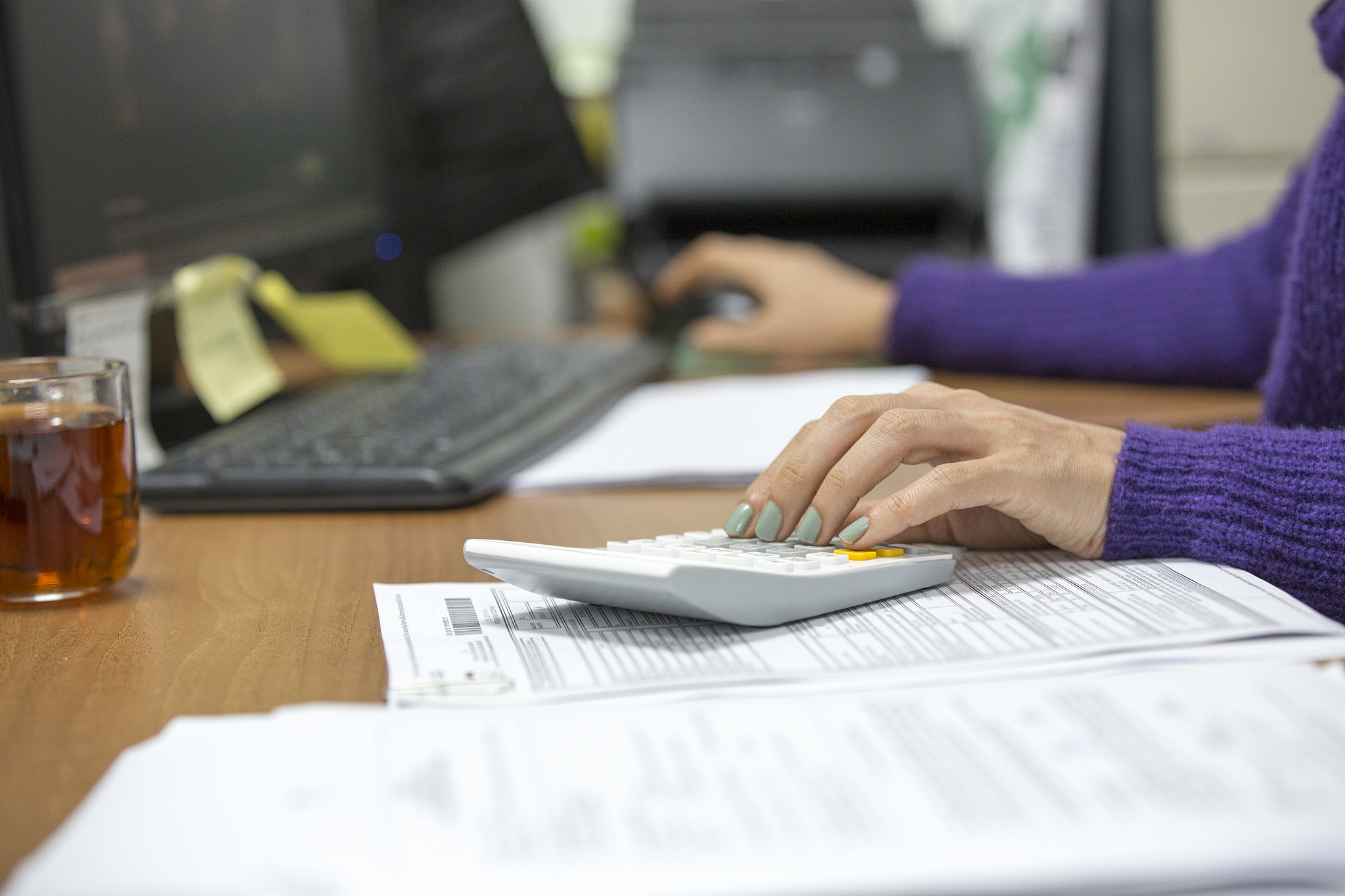 young woman working in an office. savings, finances and economy 