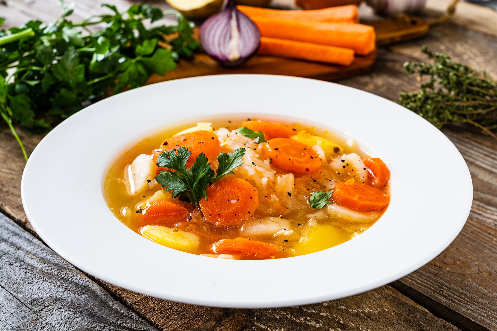 cabbage soup served on wooden table