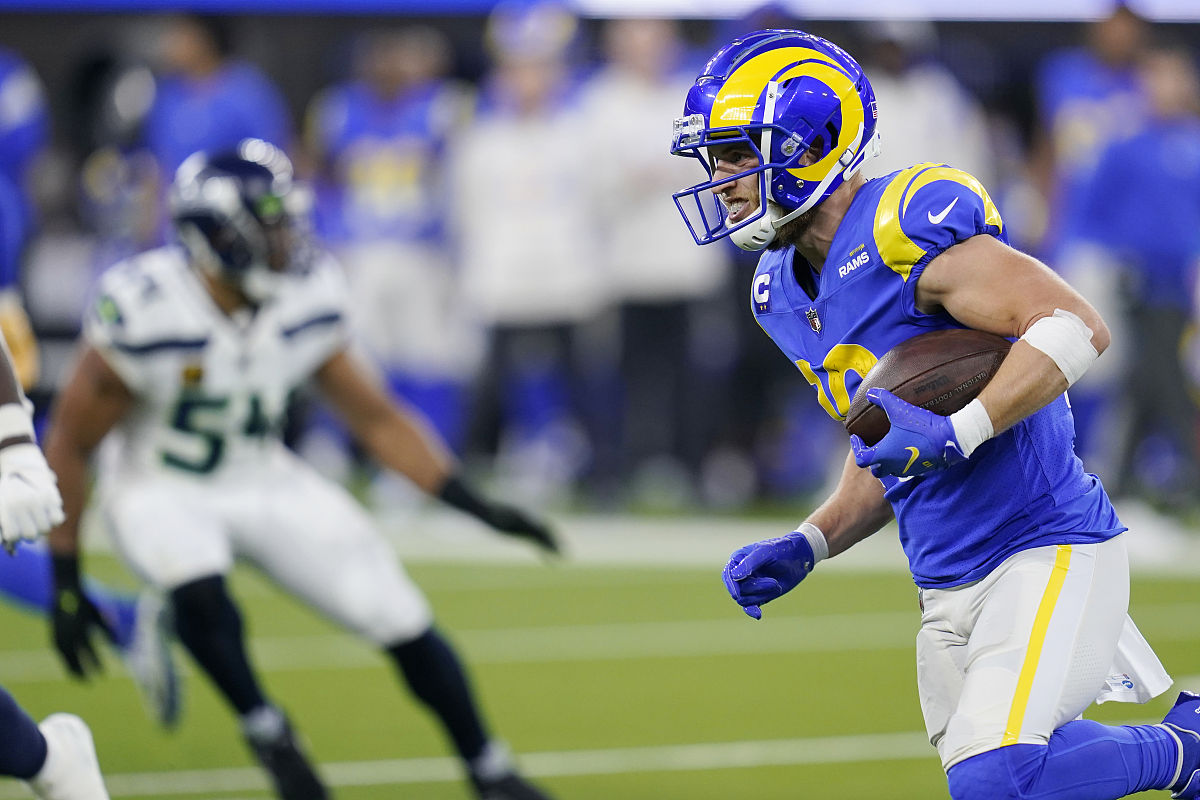 los angeles rams wide receiver cooper kupp, right, runs after a 