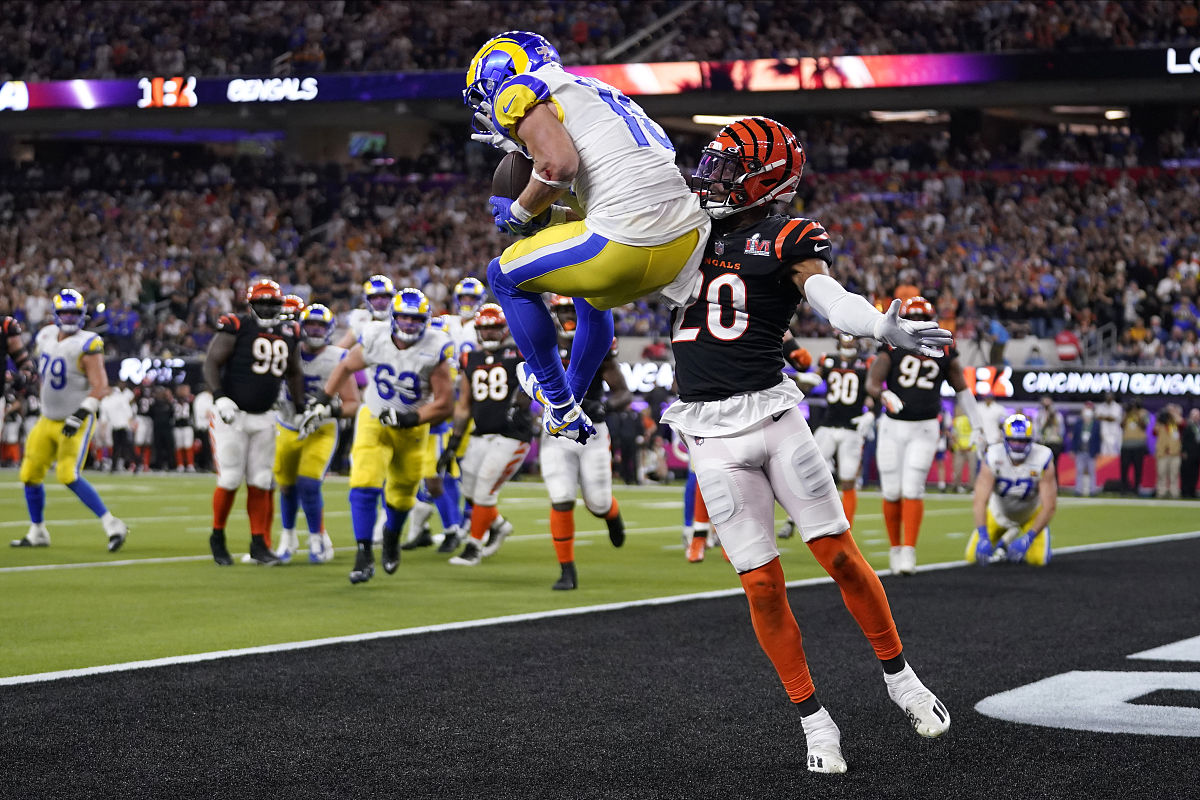los angeles rams wide receiver cooper kupp, top, catches a touch