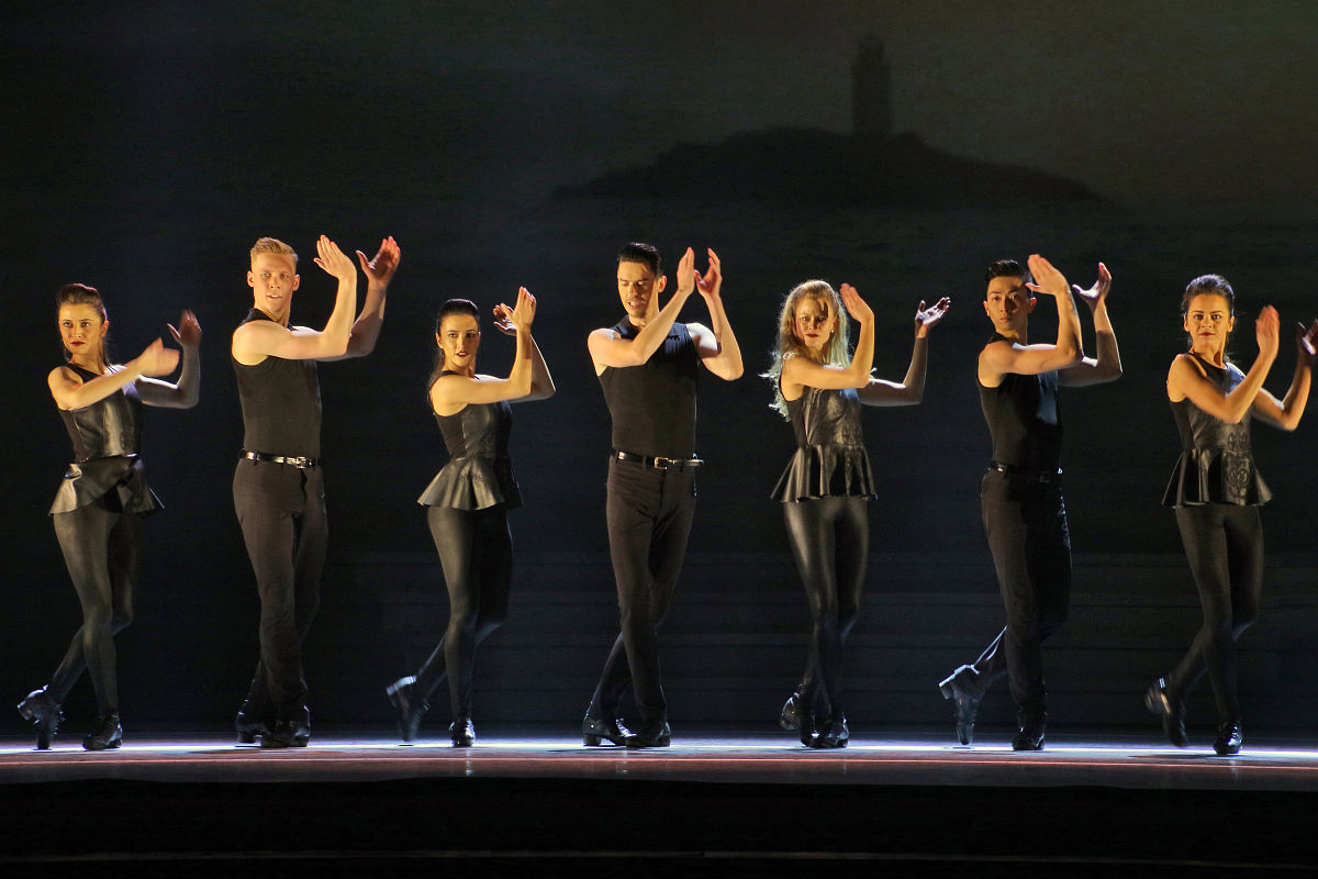 correct As depicted in the picture there are several vivacious ladies dancing intently on the stage And there are many inquisitive audiance are watching them