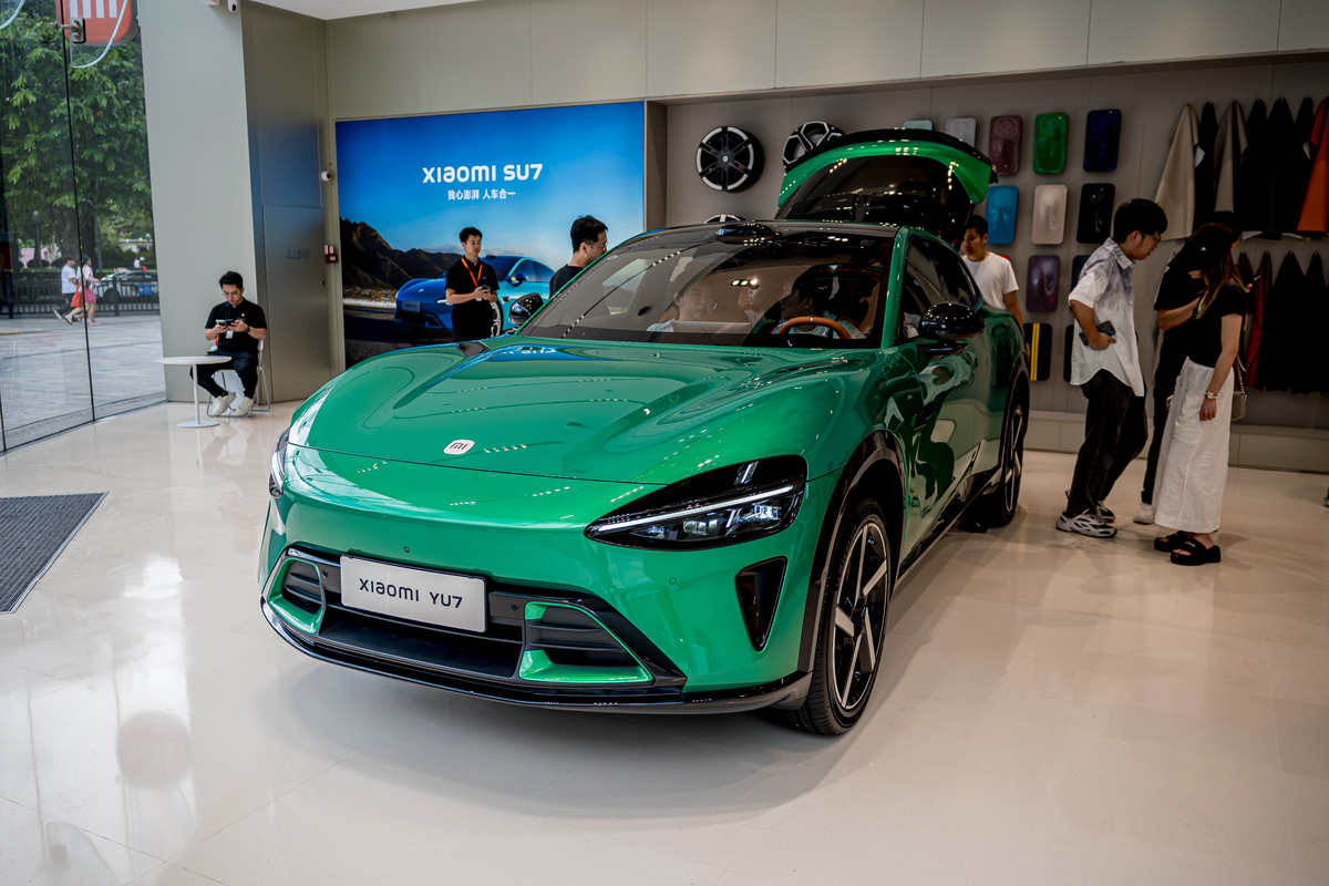 Please help me write a introduction on PEST analysis of the reasons for Tesla to build a factory in Shanghai for new energy vehiclesincluding research background、research significance and research met