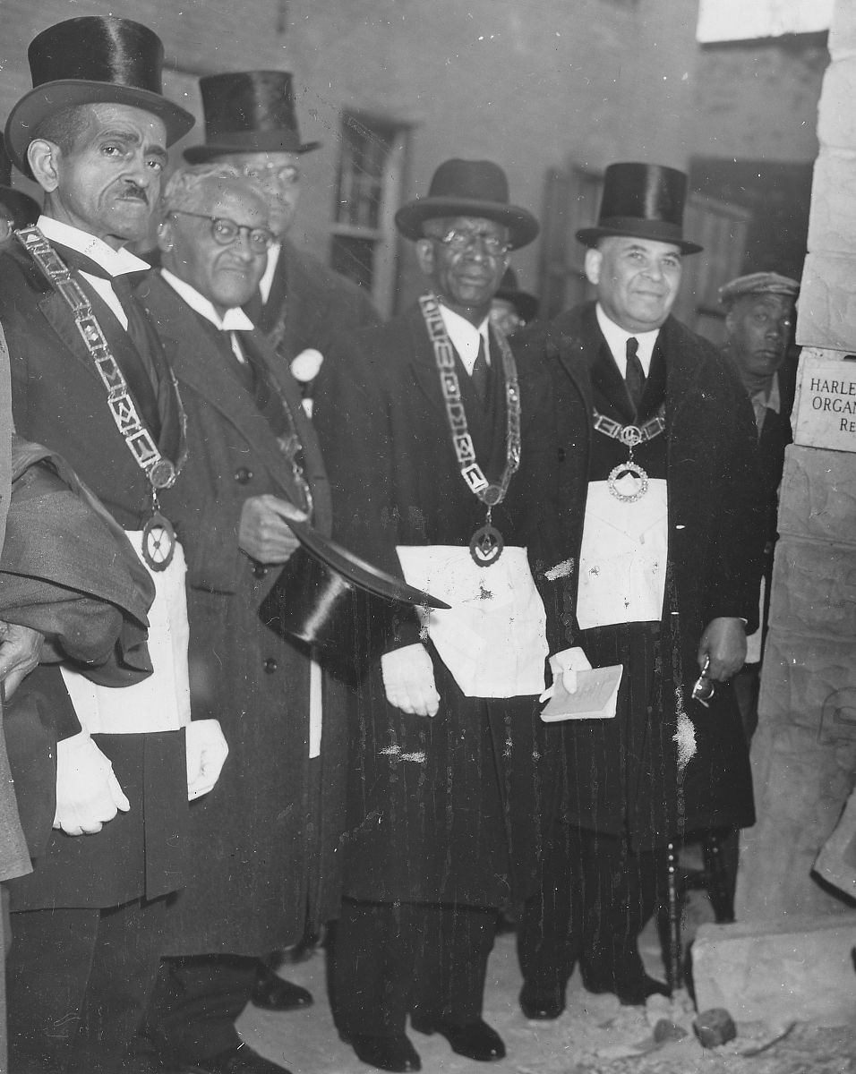 a photograph of men outside of the harlem square baptist church,