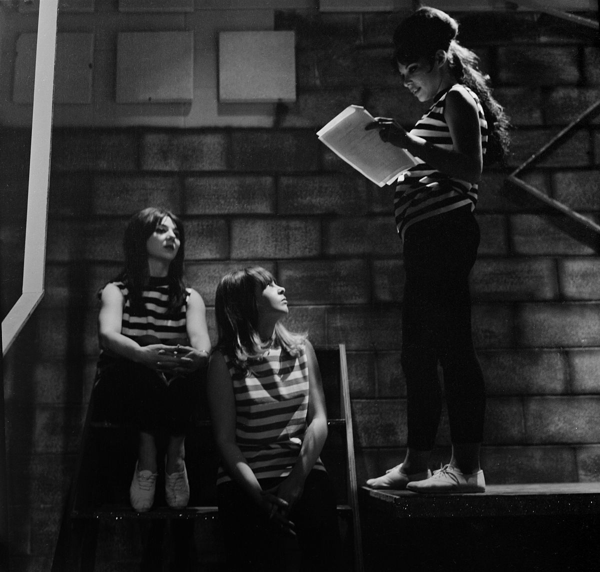 los angeles,ca - circa 1965: show dancers looks over a scripts b