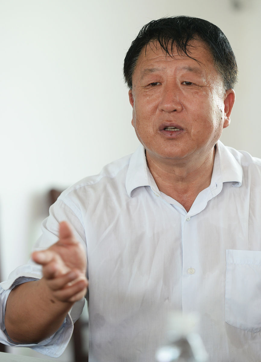 2014年11月29日,三亚,李登海在位于南滨农场的登海种业海南育种基地工
