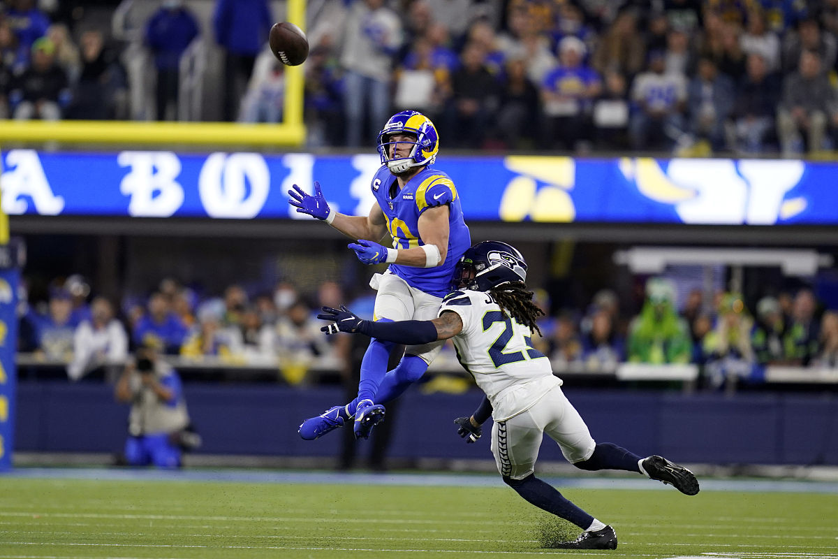 los angeles rams wide receiver cooper kupp, top, catches a pass 