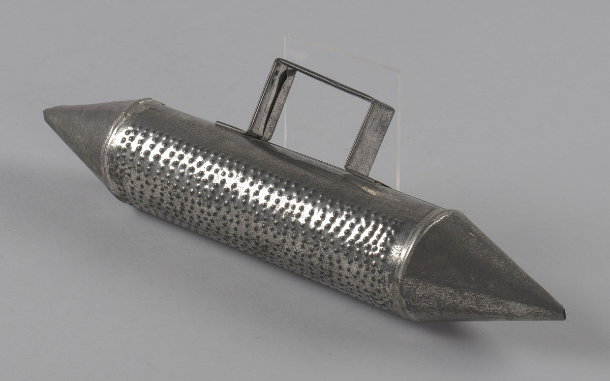 this oil can güira prop is part of a costume used by tiger hayn