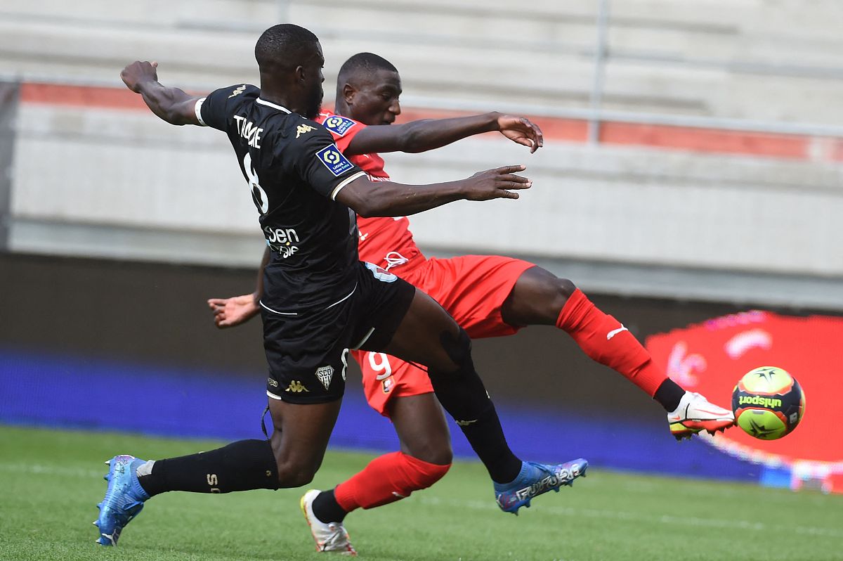 rennes' french forward serhou guirassy (r) fights for the ball w