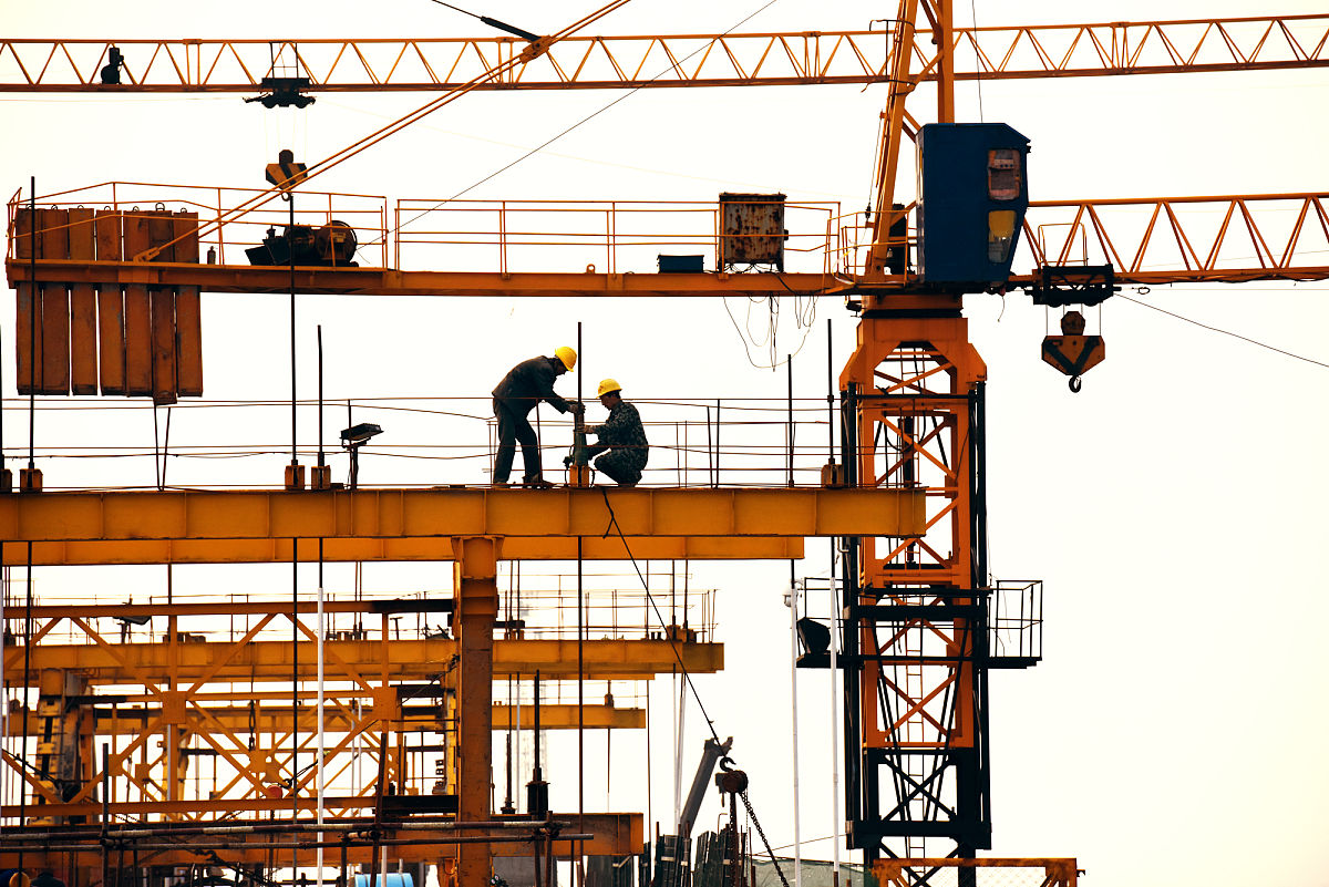 For high-altitude operations workers rely on the assistance of ladders and cranes
